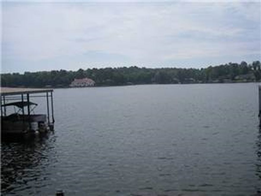 WHAT A VIEW! Walk out your patio door and be at the water's edge just steps from your door! This unit comes fully furnished and has a covered boat dock. This is a one level unit. Swimming pool, tennis court, beautiful grounds and close to everything in Hot Springs. Call today for your appointment. **Agents see Agent remarks