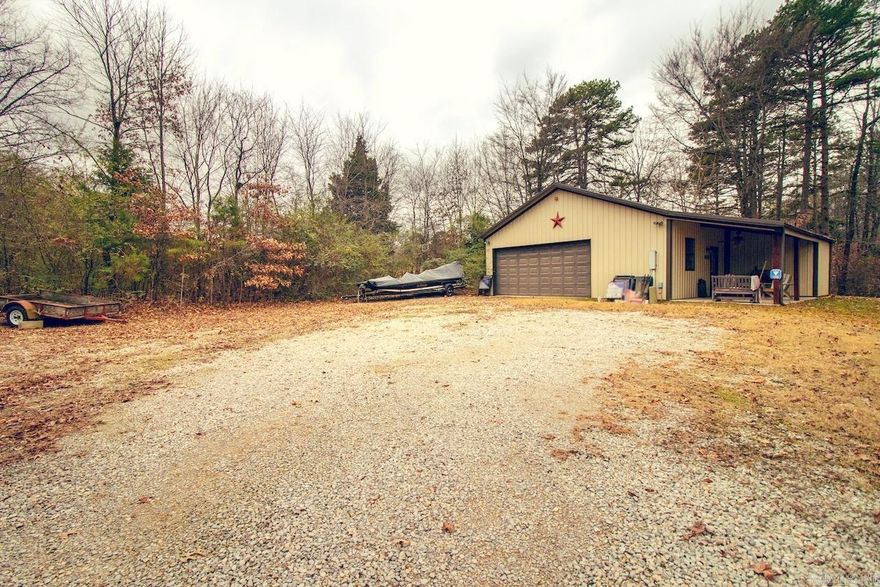4.67 acres in the city limits of Jonesboro, with city utilities. 1200 square foot square post building built in 2011. Fully insulated and heated and cooled. Small apartment with kitchenette, one full bath and living area. Covered front porch overlooking small pond and frequent deer watching. Old cypress barn. Small septic system for shop. Beautiful setting with an abundance of wildlife.