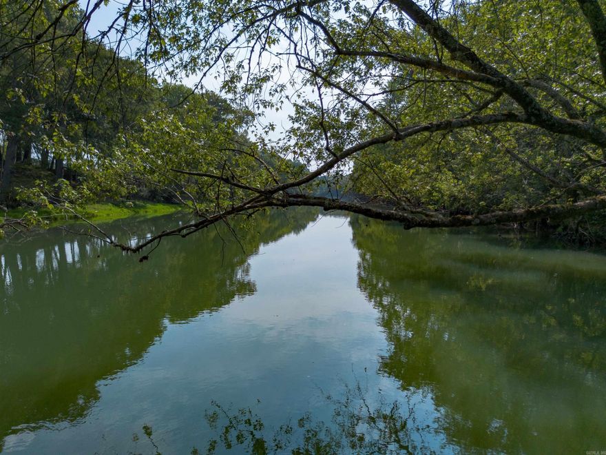 Lot #1 at The Pines on The Little Red.  1.49 acres m/l of trout fishing on your riverfront property on the Little Red River just 3 miles from Pangburn.   World class trout fishing right outside your back door! This stretch of the Little Red River is known for both quality and quantity of trout. There are numerous rainbow trout and brown trout that call this stretch of the river home. You even have access to your own private boat launch!  This property boasts access to your own private, gated boat launch. Located 3.2 miles upstream from the Ramsey's Access, and 2.6 miles downstream from the Dripping Springs Access.   If you know, the Little Red River is home for many aquatic species, and also many other species unique to a tailwater ecosystem. It's not uncommon to see bald eagles, river otters, whitetail deer, turkey, and a multitude of migrating waterfowl. There are many resident Canada geese and wood ducks! It's truly a sportsman's paradise.   This riverfront property is tucked away and protected by large, mature pine trees on the north side, and the Little Red River on the south side. For you lake lovers, you're 15 miles from the Dam Site boat launch on Greers Ferry Lake!