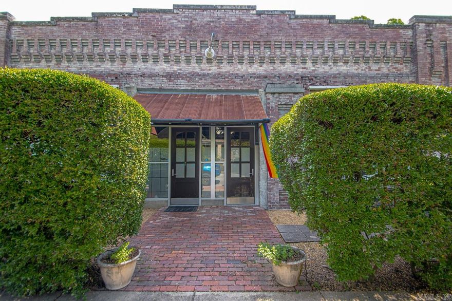 This truly one-of-a-kind property was originally the Nelson-Abeles Garage (built in 1912 and on the historic register); and has since been creatively renovated into an urban loft/mixed use property located in the vibrant SOMA District of downtown Little Rock.  This stunning conversion residence at 15th and Louisiana is 9,000 square feet total, and is currently divided into three condominium units, each with its own kitchen, bath and open floor plan that could be utilized as bedrooms/living/workspace.   The largest of the three units is 4,000 sf and fronts Louisiana Street; its open floor plan offers endless possibilities for design and layout. Soaring ceilings with exposed original steel trusses and wood planked roof, brick walls, oversized windows and polished concrete add to the urban feel. Custom steel and wood partitions discreetly conceal and reveal rooms and generous storage. Back gated entry provides for secure access to the two back units, each of which are 2,500sf rentals accessed by a private, secure lobby entrance.