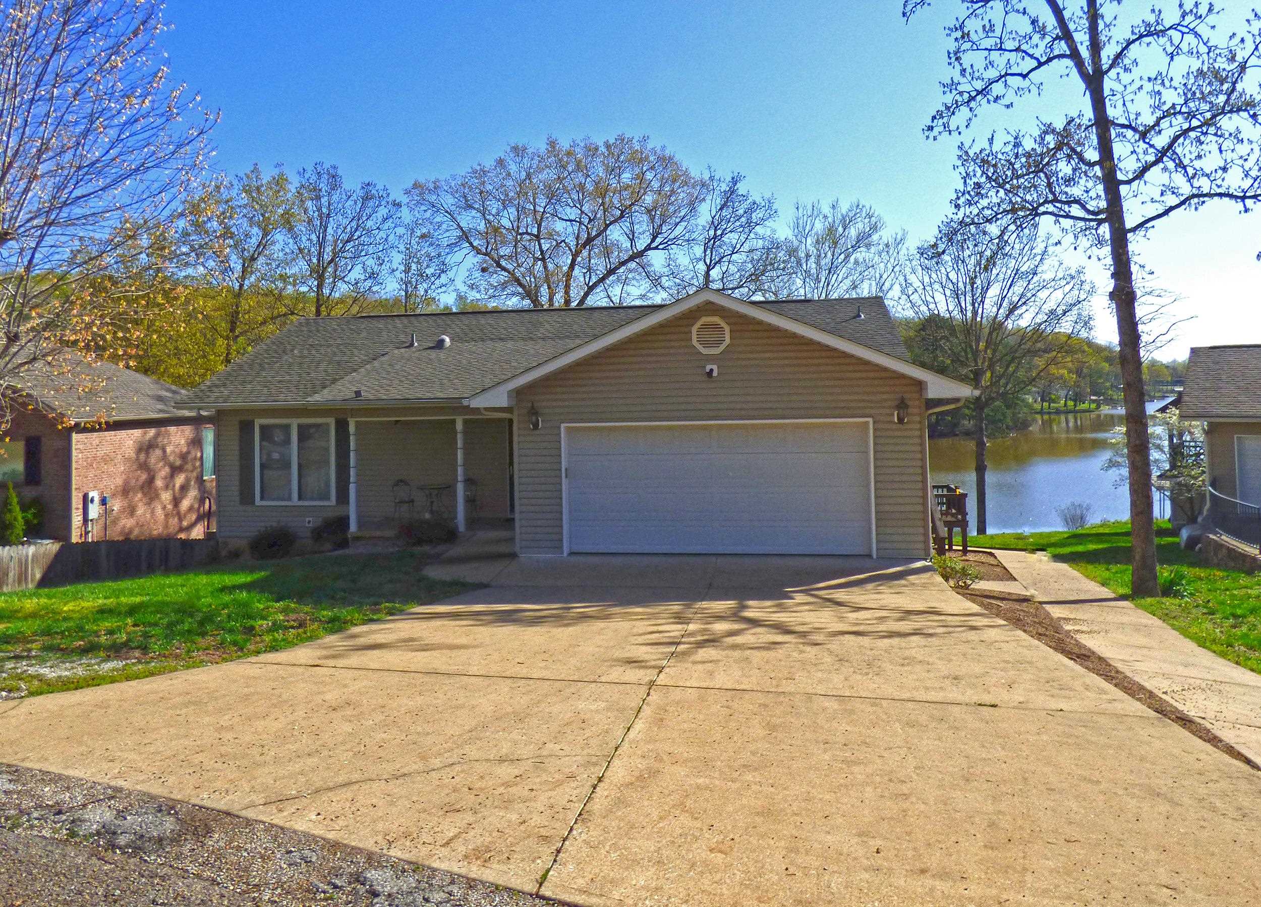 Lake Thunderbird Lakefront with Incredible View! This beautiful home has 2 bedrooms 2 baths, laundry upstairs with a large living room, kitchen and a sun room with a wood stove and gorgeous view of the lake. Once you go downstairs there is a large family room, another laundry area, the third bedroom and bath, large bonus room that could be a bunk room for extra guest, work out area, office or hobby room, small work shop. The architectural shingles were replaced in 2023. Offers 2 car garage and a partially covered deck. The best thing about this home is the amazing spot on Lake Thunderbird with breathtaking views and great water depth off the dock. Great home for Lake Living.