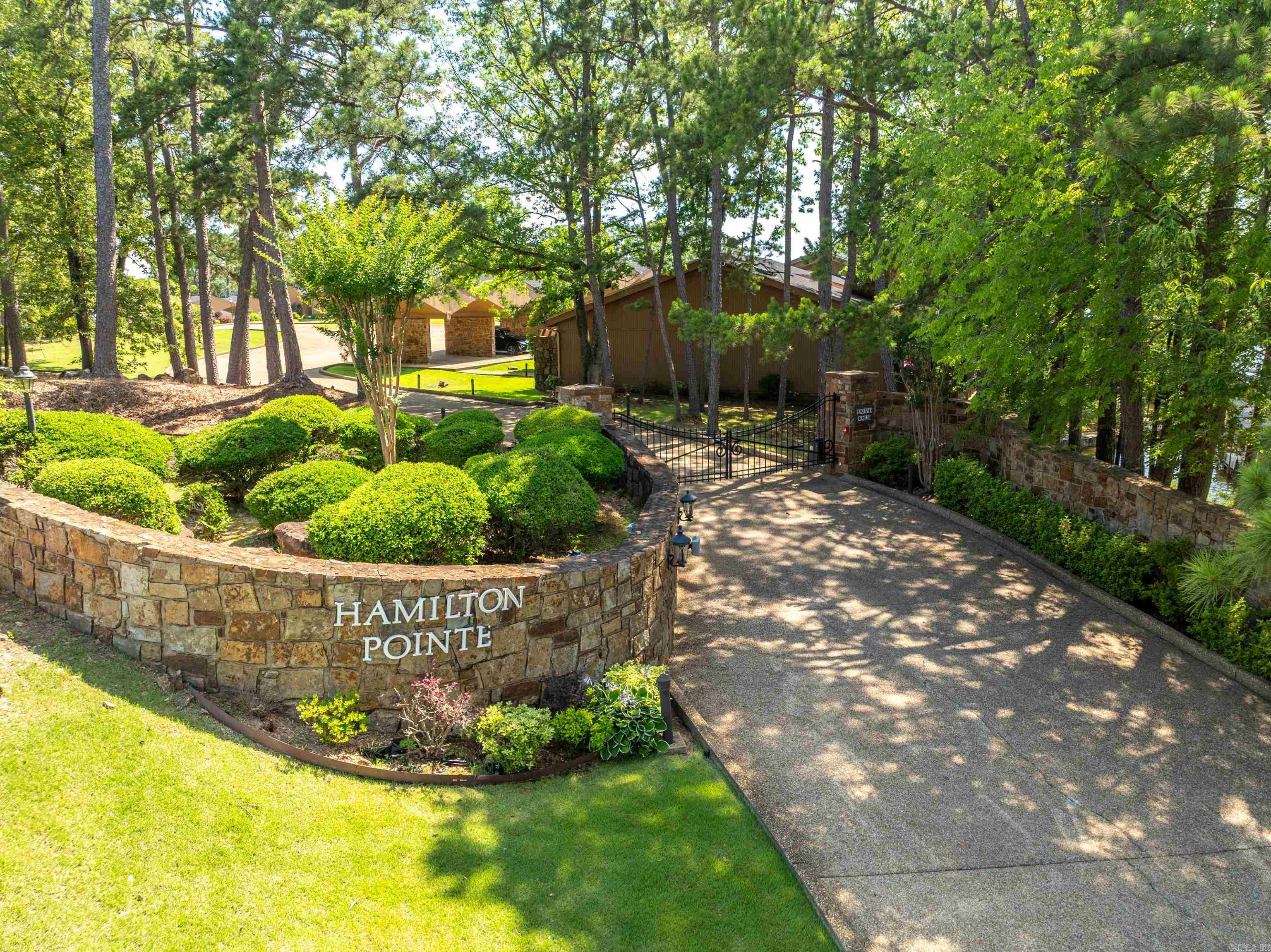 Welcome to Hamilton Pointe one of Hot Spring’s most desired locations. This large fully furnished 4 bedroom 3.5 bath unit is your perfect lakeside retreat with two living areas, two wood burning fireplaces, a bunk room, spacious closets, multiple skylights, remote-controlled blinds and two new AC units to keep you cool all summer long. Watch the annual fireworks from one of your 4 patios overlooking the lake or your covered boat slip just steps from your condo. This gated complex includes a very nice pool, clubhouse and two covered parking spaces. You cannot beat this location. All furnishings convey Agents see remarks for more details.