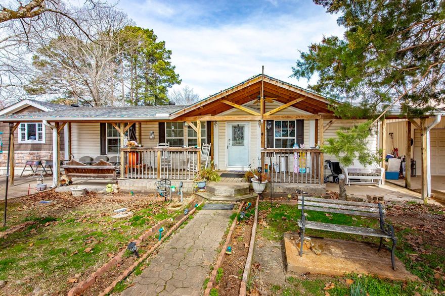 4-bedroom, 2-bath home on 1.55 acres outside city limits. Features an open-concept layout with new flooring throughout, a spacious living room, and a separate den with a wood-burning fireplace. The enclosed back porch adds extra living space, and the covered front porch is perfect for relaxing. Enjoy the 32-foot saltwater pool with deck, plus a 24x40 shop with a 24x20 attached carport—plenty of room for storage, hobbies, or equipment. Roof replaced in 2023. A great property with space inside and out!