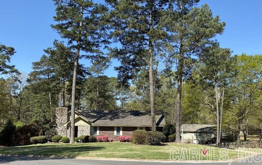 Curb Appeal? Check! Great Neighborhood? Yes! Corner Lot? You got it! Your Next Home?  Yes, please!  You'll love hanging out in the spacious, sunken living room in front of the cozy wood-burning-fireplace, which is flanked by lots of built-in shelves and cabinets and features cathedral ceilings. The primary bedroom features an en-suite bathroom and extremely generous walk-in closet! 3 bedooms and 2 bathrooms are upstairs, but when you go downstairs, you'll find the finished basement is set up as another fully functional living space, complete with full kitchen, full bathroom, living room and bedroom.  Not to mention it's a walk-out with it's own carport and accessibility into the basement apartment! Large 2 car garage on main level has plenty of room for vehicles and toys. Your kids and puppies will LOVE all the beautiful lawn to play on, and the sprinkler system will keep the beautiful lawn green in the hot Arkansas summers!  There is an alarm system that'll just need reset with your information, and the newer, insulated winows and doors were replaced approximately 2017.  Don't sleep on this one-call today!  Agents, see remarks.