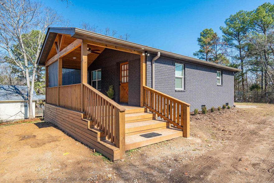 Extreme Makeover! This stunning home has been fully renovated down to the studs. As you pull into the driveway you’ll notice the complementary colors drawing your focus to the new covered porch with a wood ceiling and retractable privacy screens, making it an inviting space to relax and unwind. Step inside and be greeted with the sophisticated modern updates that include a wall opened between the living room and dining room, providing a spacious and airy feel. The large gourmet kitchen features stainless steel appliances, shaker cabinets, butcher block countertops, island with extra seating, and stylish floating shelves. As you enter the hallway, the chevron accent wall is sure to catch your eye as it leads you to 2 guest bedrooms, laundry, full bathroom, and primary bedroom with a full bathroom added. Both bathrooms feature beautiful vanities and modern fixtures. Don’t miss the basement that offers central H&A and inside & outside access, making it easy to finish out. The home is on a large lot with a deck and fence in the rear and located within walking distance to Hollywood Park, Hot Springs Creek Greenway trails, dog park and Oaklawn Race Track, making it a great investment.