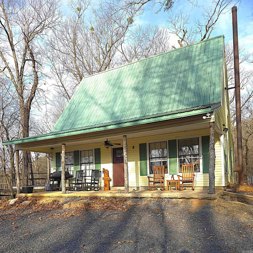 Wake up to mountain views, the sound of nature, & deer wandering through your own backyard. This charming 100 acre +/- cabin, surrounded by the Ouachita Mountains is the definition of a peaceful retreat- quiet, scenic, & surrounded by natural beauty. A new roof on the cabin will be installed in two weeks. Furniture negotiable. Butcher block kitchen counters. Window units and electric heat. New submersible pump installed for well. New water filtration system. Chicken coop. Storage shed with slab floor. The property offers multiple additional building sites, ideal for expanding with more cabins, guest houses, or investment opportunities. Enjoy the serenity of mountain living while remaining just 15 minutes from town, providing the perfect balance of seclusion & convenience. Whether used as a personal retreat, vacation getaway, or rental opportunity, this property delivers rare versatility in a stunning setting. Agents, please see remarks.