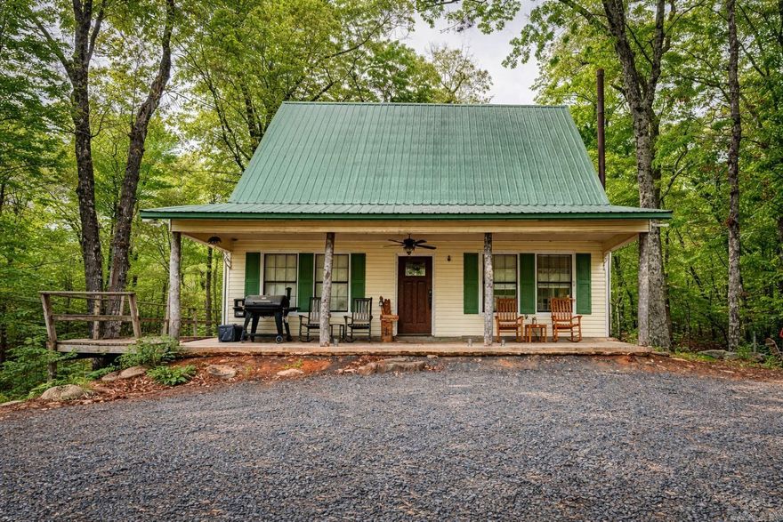 Wake up to mountain views, the sound of nature & deer wandering through your own backyard. This charming 100 acre +/- cabin, surrounded by the Ouachita Mountains is the definition of a peaceful retreat- quiet, scenic, & surrounded by natural beauty. Furniture negotiable. Butcher block kitchen counters. Window units and electric heat. New submersible pump installed for well. New water filtration system. Chicken coop. Storage shed with slab floor. The property offers multiple additional building sites, ideal for expanding with more cabins, guest houses, or investment opportunities. Enjoy the serenity of mountain living while remaining just 15 minutes from town, providing the perfect balance of seclusion & convenience. Whether used as a personal retreat, vacation getaway, or rental opportunity, this property delivers rare versatility in a stunning setting. Agents, please see remarks.