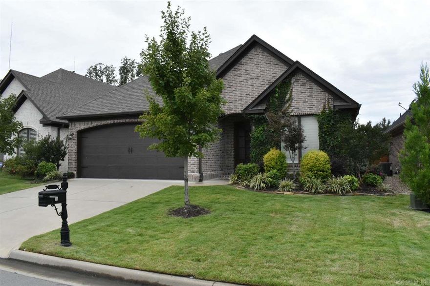 Luxury one level brick with many upgrades and finishes. Private backyard and patio with lush landscape. Open floor plan- kitchen den combination. Hardwoods throughout; no carpet. Plantation shutters, marble counter tops, custom sprinkler system, glass bead fireplace, & surveillance, video system. Chef's kitchen- gas cook top, island sink, breakfast bar, stainless appliances, and custom cabinetry. Cozy yet elegant.