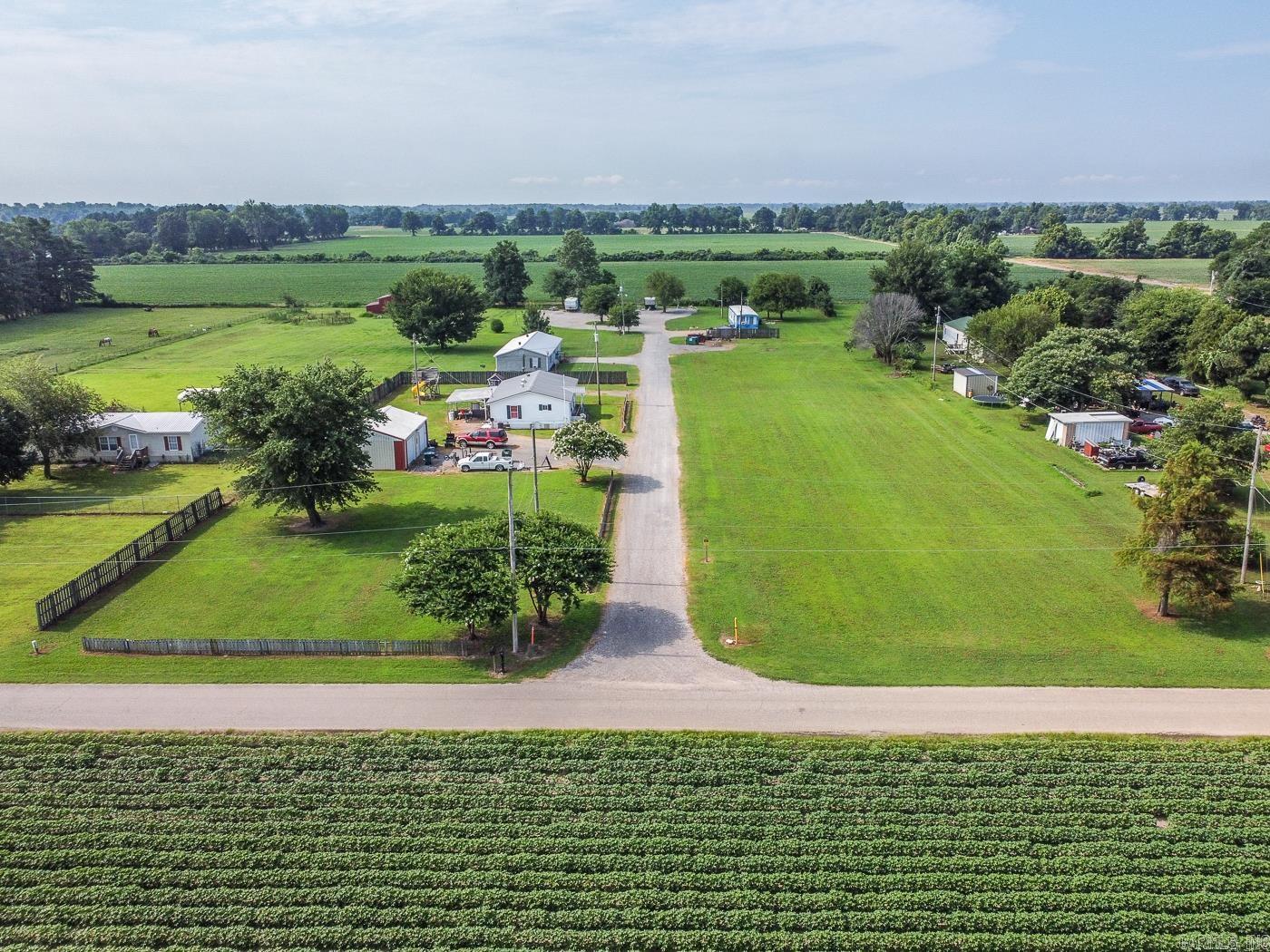 Welcome to Market 911 E Olympia in Manila, Arkansas. Sprawling across 3 acres, this unique investment property features 3 mobile homes and 6 RV lots with a combined monthly rental income of $5,100. The mobile home at 911 A offers 1,400 sq ft, 3 bedrooms, 2 baths, and includes a shop with electricity. 911 B is 1,440 sq ft with 4 bedrooms and 2 baths, providing ample space for larger households. 911 C, at 840 sq ft, features 2 bedrooms and 1 bath. The 6 RV lots add flexible income potential, catering to both short-term and long-term renters. This property is well-suited for investors seeking steady cash flow and multiple rental streams. Enjoy the privacy and possibilities of a large acreage setting, with room to expand or further develop. Call today to schedule a tour and explore this rare opportunity to own a multi-unit income property with significant upside potential.