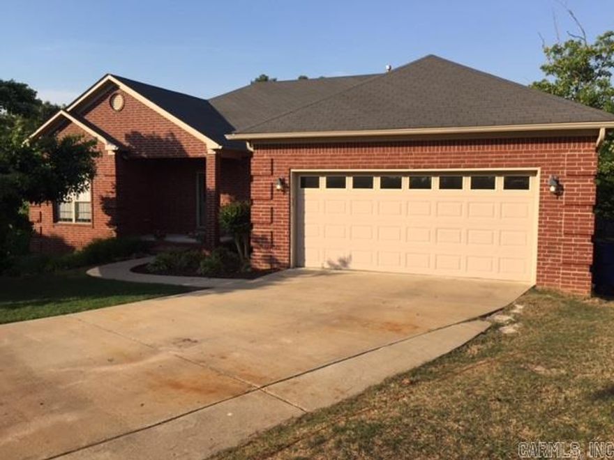Wonderful split floor plan with a workshop area under house. Master has a nice sitting area, 2 sinks, jacuzzi, shower.   Yard is filled with many different kind of trees.  New carpet-2015.  Kitchen has pantry, under cabinet lights.  Shop has electricity has decks for storage. Partially floored attic, backyard has unground sprinkler, front yard has above ground pex-tubing that is regulated by programmable sprinkler control. Log cabin dog house will convey.  Measure of sf is approx.  Agents see remarks