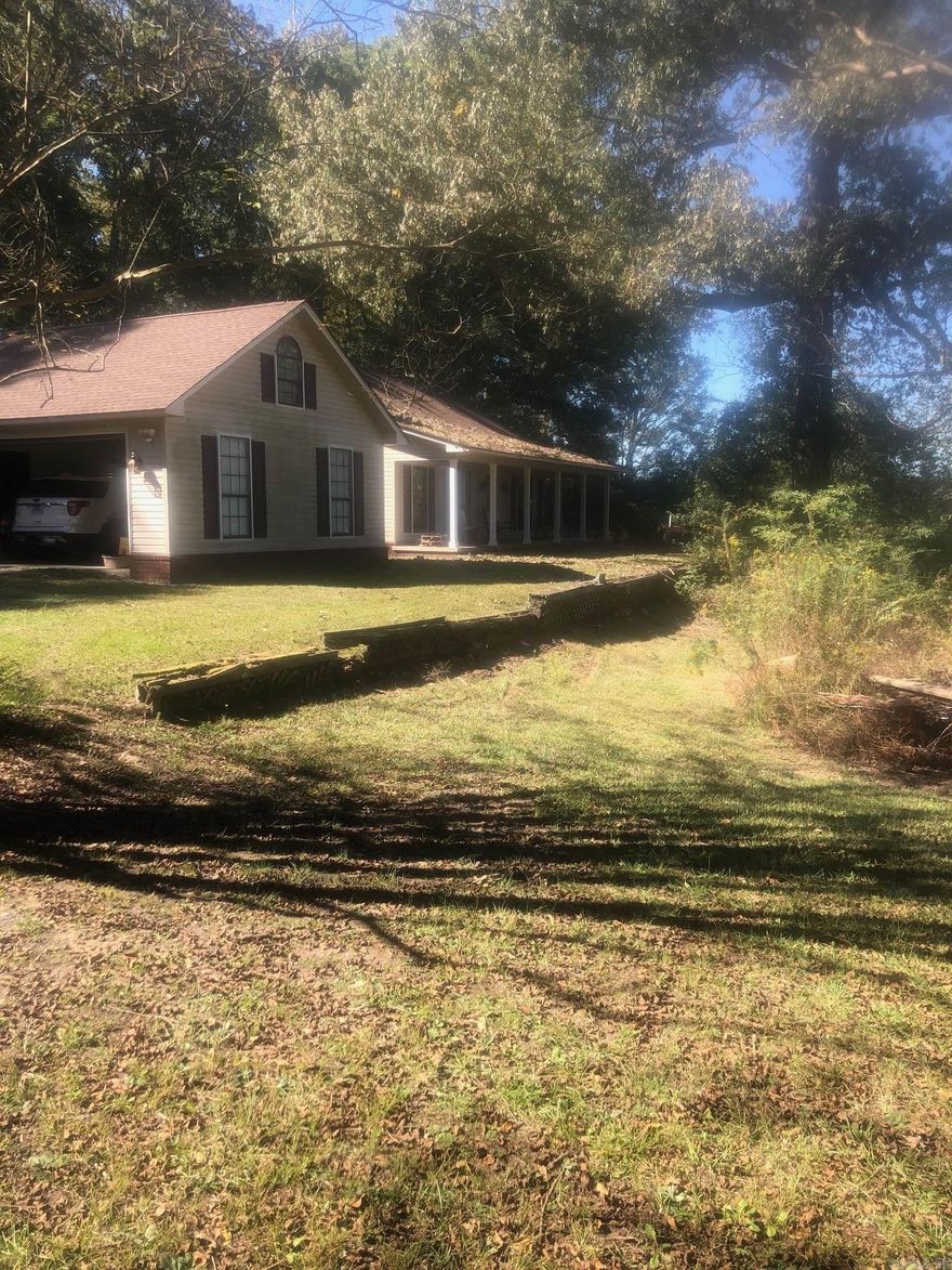 BEAUTIFUL HOME WITH COUNTRY SETTING AT THE EDGE OF TOWN.  TOO MANY FEATURES TO NAME!  LARGE LIVING AREA WITH FULL BRICK FIREPLACE & BEAUTIFUL WOOD, LARGE KITCHEN WITH LOTS OF BUILT-INS, YOU WILL LOVE THIS SUNROOM OR OFFICE, MASTER SUITE IS COMPLETELY PRIVATE. GRAND MASTER BATH & WALKIN CLOSETS, 2 SEPARATE BEDROOMS WITH JACK & JILL BATH AND A SEPARATE GUEST BATH, DOUBLE GARAGE AND SMALL STORAGE BUILDING. HEAT & AIR 2 YEARS OLD.  THIS COULD BE YOUR DREAM HOME!