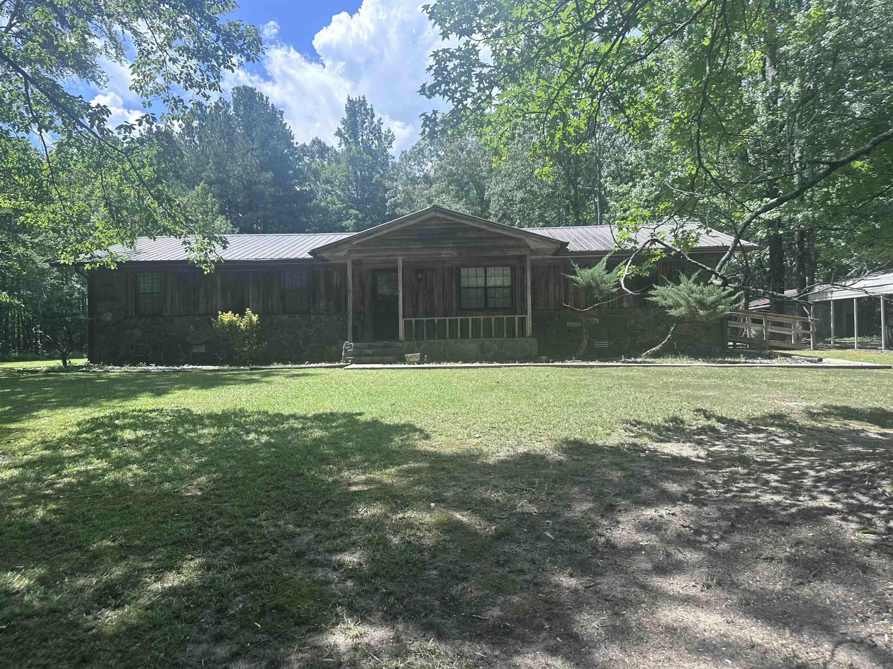 Charming 3-Bedroom, 2-bath Country home on 2.5 Acres - Watson Chapel Welcome to your peaceful retreat just off Rayhan Road! This beautiful 3 bedroom, 2-bath home is nestled on 2.5 acres of land, surrounded by mature trees and nature--offering the perfect blend of privacy and serenity. Enjoy the quite outdoors with plenty of space to garden, play, or simply relax. With a country feel just minutes from town, this home offers the best of both worlds. Don't miss your chance to own this peaceful slice of Watson Chapel.