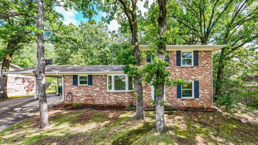 Charming 4-Bed, 2-Bath in the Heart of Midtown! This well-maintained home features energy-efficient windows throughout and a spacious layout perfect for modern living. The kitchen includes granite countertops, a breakfast bar, stainless steel gas range and appliances, and opens to a cozy living area—ideal for entertaining. Just off the kitchen, enjoy a built-in office space. A bright bay window highlights the dining area with lovely views. Access a private patio through French doors in the backyard plus a bonus storage room. A second, generous living room greets you at the front of the home. The primary suite with updated bath is downstairs, while three additional bedrooms and another updated bath with built-ins are upstairs.