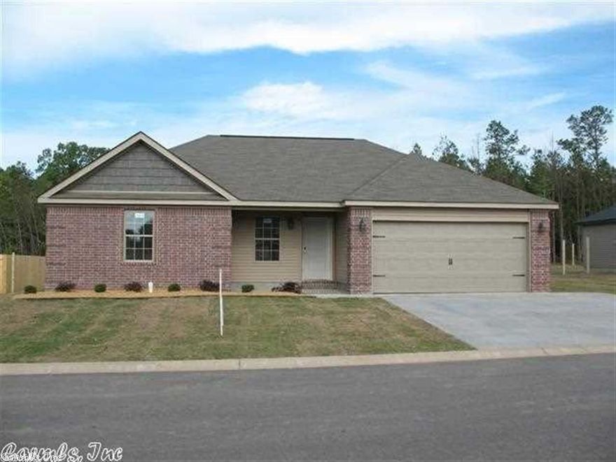 No wasted space at all.   Custom cabinets, nicely arranged kitchen with sep pantry, stainless appliances in spacious kitchen.  Master has large walk-in closet, double vanities, jetted tup, sep shower and double sinks.  Extra nice landscaping and privacy fenced yard.**3 CAR WIDE DRIVE** Qualifies for ZERO RD LOAN. CLOSING COSTS PAID!Great school district, local shopping and even a brand new Harp's Grocery!! (NO IMP FEES)