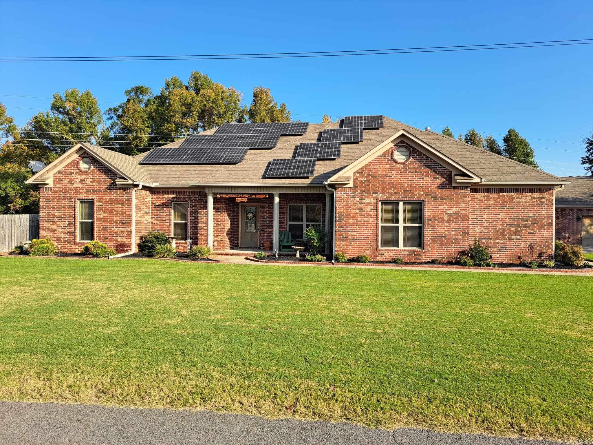 Charming to say the least.  This 4 bedroom 3 bath with formal dining and hearth room has so many extra.  Wooden blinds, lots of closets, new flooring 2023. Hearth room (heat and cool) added in 2023.  2 bathrooms on west side updated in 2023. Kitchen open concept, countertops, and subway tile done in 2023 New electric fireplace in main bedroom. Shower in main bathroom new 2024.  1 tankless water heater gas and 1 electric.  3 car garage attached to home. another single garage detached (with heater).  Lots of shop space. RV parking with a 14 foot electric door.  60 foot deep. 50 amp plug in.  RV dump goes to septic system.  Generac 24K generator on natural gas (Summit) Ask agent for details solar panels convey  See agent details