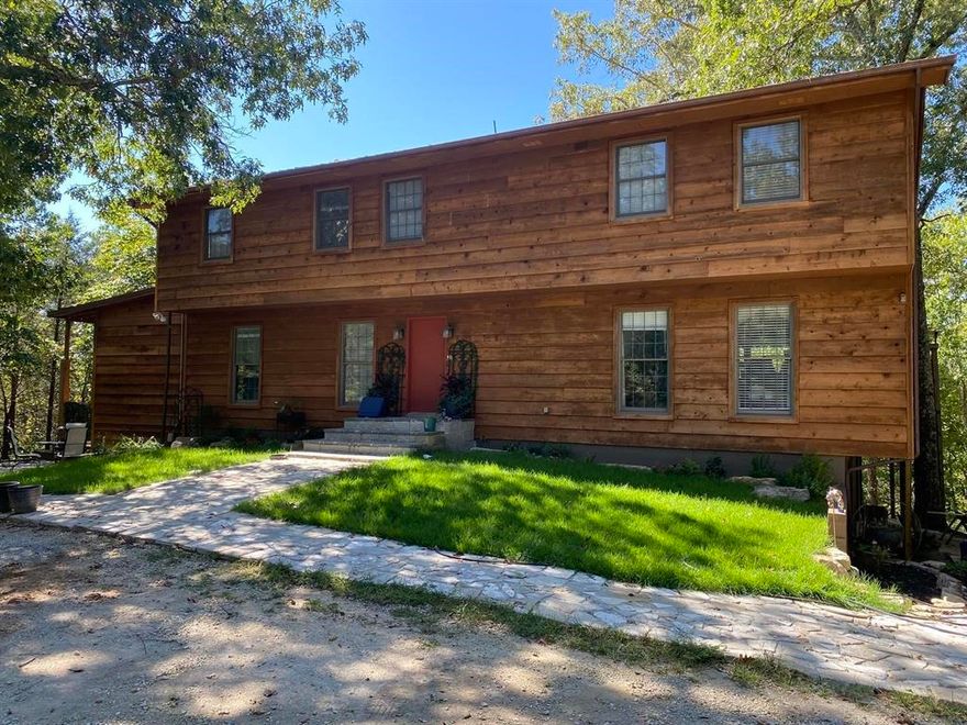 Land for sale in Calico Rock, Arkansas, 200± acres offers a rare blend of privacy, natural beauty, and versatility. Just minutes from the world-famous White River, this expansive tract features rolling hills, mature hardwood timber, abundant wildlife, and endless opportunities for outdoor recreation including hunting, hiking, and exploring. The property is improved with multiple dwellings, making it ideal for a private family compound, retreat center, or income-producing investment. The main residence is a spacious lodge-style home designed for both everyday living and entertaining, featuring expansive covered porches and elevated decks that overlook the surrounding wooded landscape and an inviting in-ground swimming pool. Additional cabins on the property provide comfortable guest accommodations and are well-suited for Airbnb or VRBO rentals, offering strong income potential. Whether you are seeking a private Ozark retreat, hunting property, multi-generational estate, or short-term rental investment, this property delivers unmatched flexibility. Located in North Central Arkansas, Priced to sell at $1,100,000