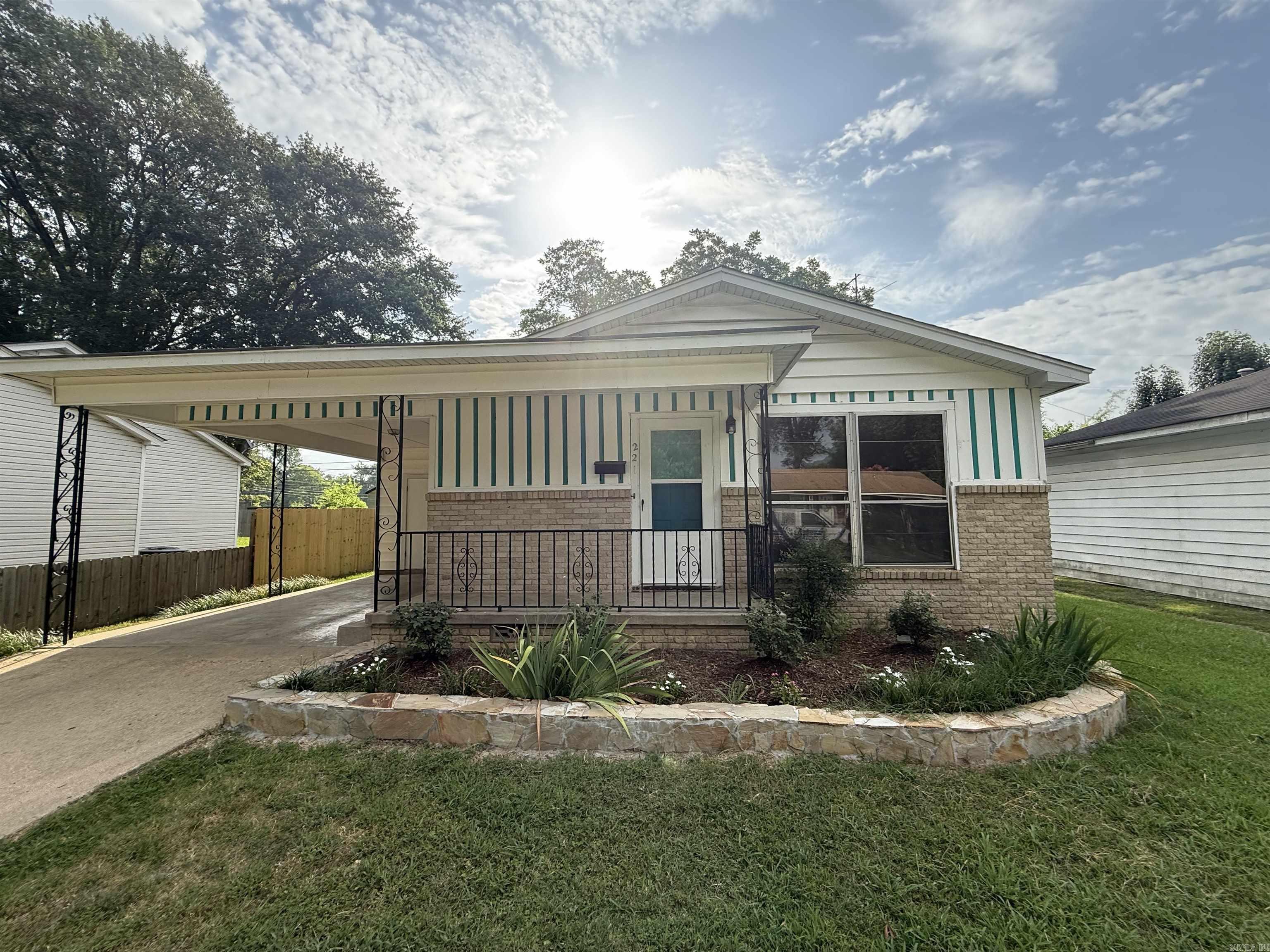 Steps to Caldwell Elementary! Seconds to Downtown Benton! This location has it all. walk through the front door to a living dining combo with new tile floors and refinished original hardwoods. in the kitchen you will find all of today's features. walk down the hall to the updated bathroom complete with title tub/shower combo. The home features 3 bedrooms all with refinished hardwoods. One of the bed rooms includes an updated half bath. Outside you will be able to park your car out of the elements under the covered carport. The laundry room also features new tile floors. Walk past the carport to a large screened in porch. The back yard features a new wood fence and a completely refurbished fire pit area. You'll need to see this one in person!