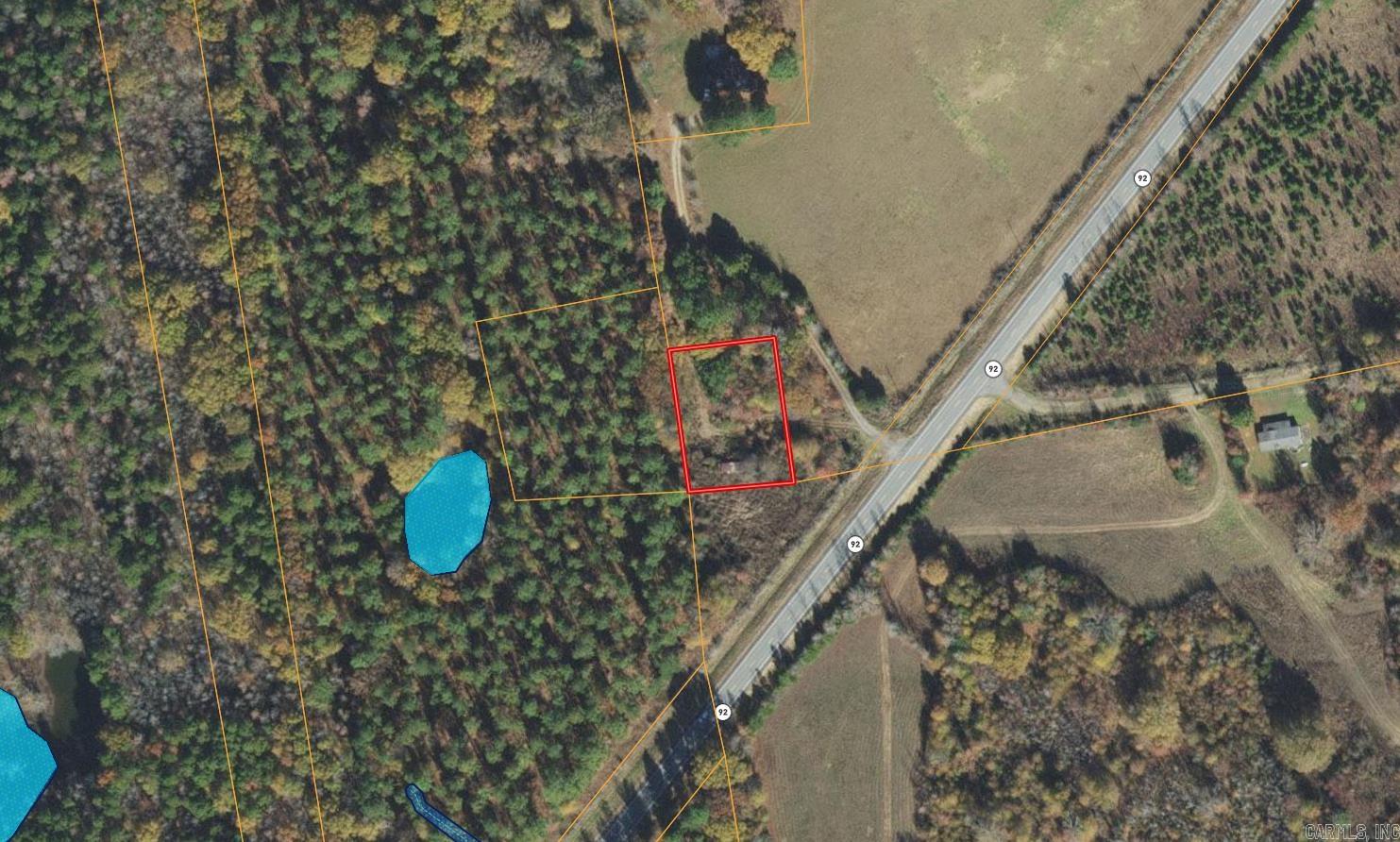 Flat wooded half acre of ground non restricted. Power and water are available will need a septic system