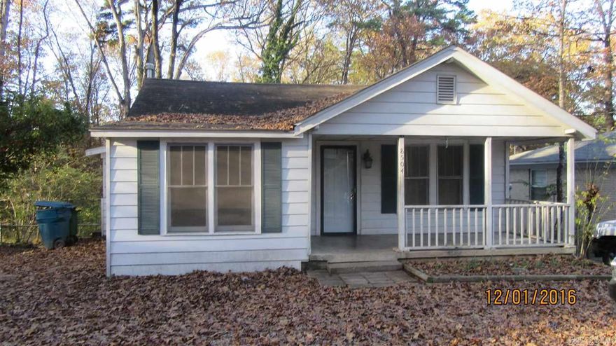 Cute bungalow with a covered front porch, lots of big shade trees, large Great Room Open Floor Plan has hardwood floors and a big rock fireplace with gas logs! 1 Bedroom plus an office or small nursery. Floor furnace and 2 window air conditioners, refrigerator and stove. Washer & Dryer connections. Has a large basement with a separate room - perfect for crafts or storage. Workshop are with walk out basement. Close to I-430 and I-630. Nice area.  Available now! Rent is $625/mo. Deposit is $625.