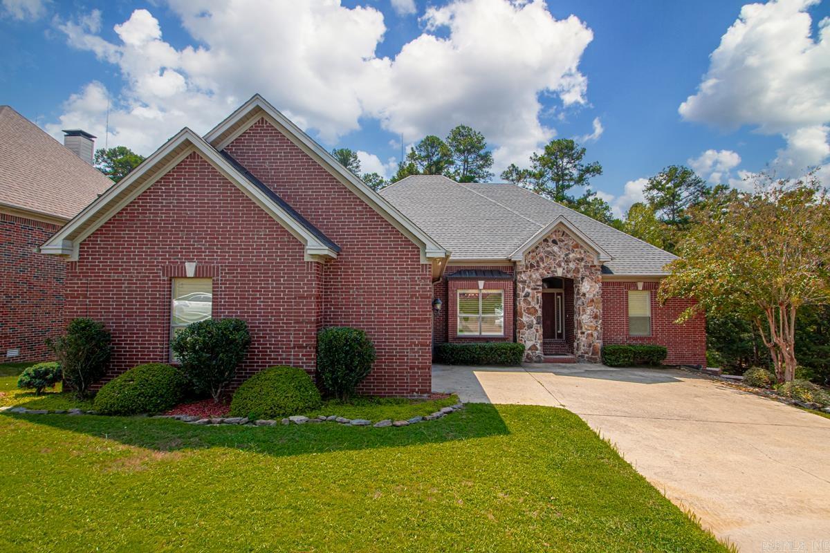 Welcome home to the highly sought-after Chenal Valley BrontĆ« Court subdivision! This stunning five-bedroom, three-bath residence boasts an impressive 3,568 square feet and is beautifully maintained, sitting on one of the largest lots in the neighborhood. As you step inside, you'll be greeted by soaring ceilings and an open-concept layout that creates a warm and inviting atmosphere. The living area features a cozy wood-burning fireplace, perfect for gatherings, while large windows fill the space with tons of natural light. The gourmet kitchen is a chef's delight, showcasing granite countertops and a surface electric cooktop, making meal preparation a breeze. On the main level, you will find three well-appointed bedrooms, including a spacious primary suite that serves as your personal retreat. The primary suite is complete with a spa-like bathroom and an oversized walk-in closet, offering both luxury and convenience. The lower level of the home offers two additional rooms, full bath and a large bonus room, providing versatile space that can be tailored to your needsāideal for a home office, playroom, or entertainment area. Located near highly rated schools, dining, and shopping.