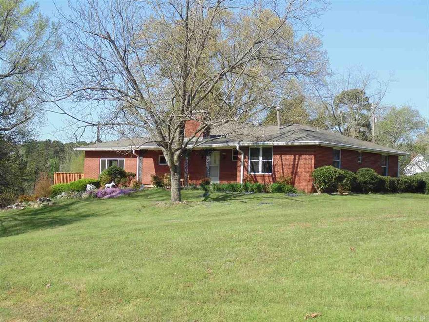 LOOK AT THIS well built home on over 3 acres of land with fruit trees and a pond.  Large 24 X 28 game room with pool table and bar with built in fridge.  2 fireplaces, 1 upstairs and one in basement.  New appliances in updated kitchen and master bath, they both look great.  Detached 2 car garage with storage for lawn equipment + 1 car carport and circle drive.   Basement has 2 storage rooms and workshop. Very well maintained with LOTS of special features.  See assoc docs for listing of features.