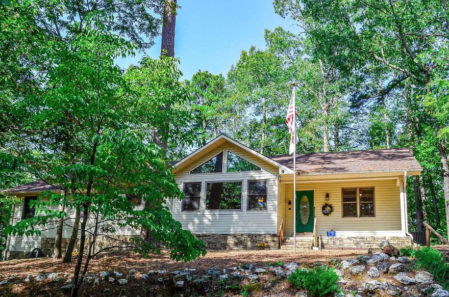 Come see this secluded hideaway, nestled in the beautiful Hot Springs Village forest with GREAT PRIVACY and natural wild life at your fingertips.  This one level home situated on a .37 acre lot offers split bedrooms, cathedral ceilings, wood burning fire place, granite counter tops, and a LARGE workshop.  Upgrades include master bath shower, water heater, gutters, two sets of doors, refrigerator, Heat Pump, Garage Door, Wood Floors, New Roof, Workroom lights, and newly painted interior.  Average Electric Bill $108 per month.  Please See Agent Remarks. Be sure to add this one to your "must see" list...