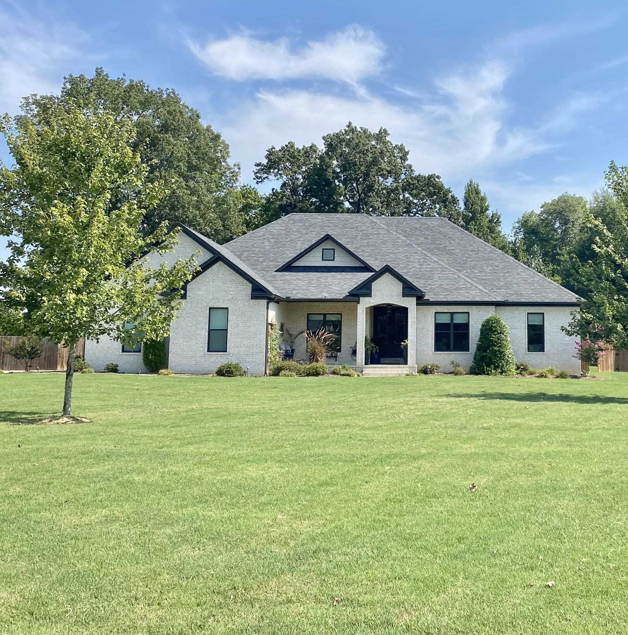 Gorgeous lot Peaceful subdivision Custom Traditional home on 2.6 acres in a wonderful established neighborhood, fully fenced with beautiful wooded area in the back affording complete privacy. Nice landscaping with lighting, and a large covered back patio, housing a full wood-burning fireplace with gas starter. A pergola is attached to offer additional entertainment possibilities. A six-person hot tub conveys with the property, along with a firepit area. There is a fenced garden with a utility shed and five raised garden beds. Transfer of info from MLS #24-1450 for entry