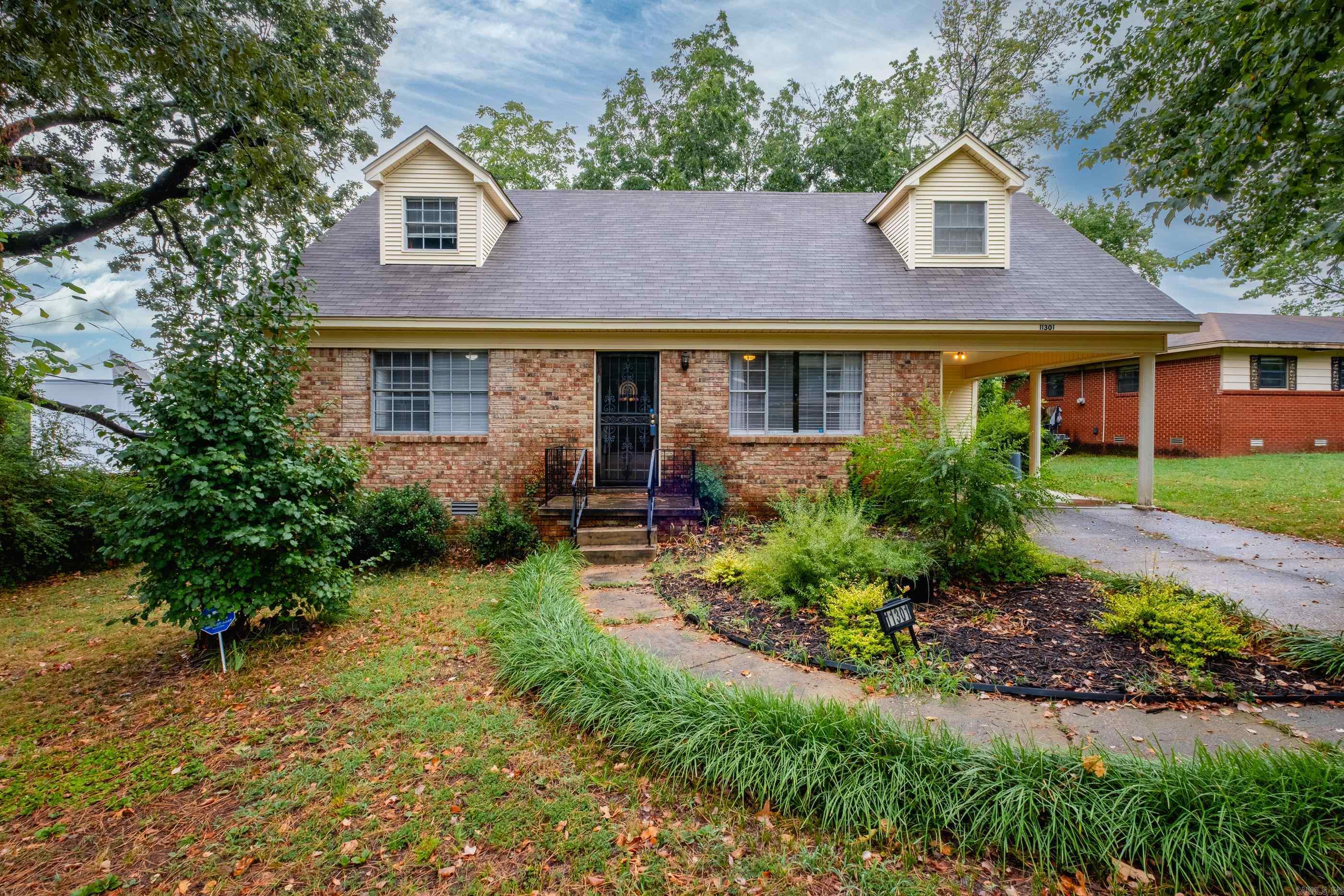 Charming Traditional on a Quiet Cul-de-Sac Welcome to 11301 Eric Lane, a classic two-story home perfectly situated in a peaceful cul-de-sac in West Little Rock. This inviting residence offers a thoughtful layout with two bedrooms and a full bath upstairs and two bedrooms and a full bath downstairsāideal for flexible living arrangements. Step inside to find site-finished hardwood floors that add timeless warmth to the first floor. The home also features a separate laundry room, fenced backyard for privacy, and a one-car carport for convenience. With its combination of comfort, charm, and location, this home is a fantastic opportunity to enjoy a traditional lifestyle in a quiet neighborhood setting. Roof was replaced May 2024.