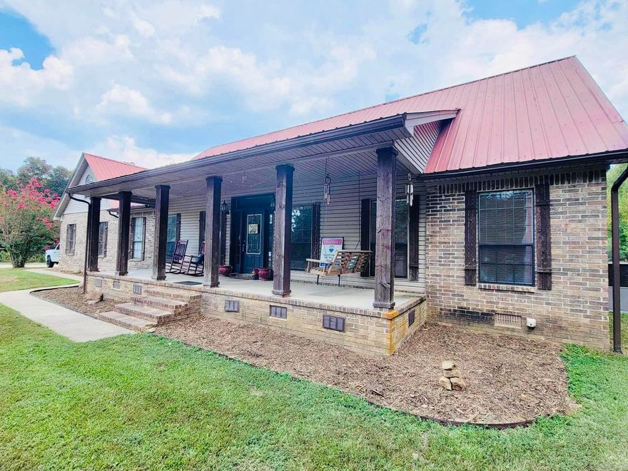 Rustic charm and serene living in this enchanting rural home!  With 2.46 acres of land surrounding this three bedroom, two bath home you will have plenty of space to enjoy outdoor activities, gardening, and bonfires with your friends and family!  Solar supplied electric house, tankless water heater, granite!  Separate 2 bedroom/1 bath living unit with washer/dryer connections and carport! Also included on this property is a HUGE 2-bay 40 x 20 Shop!  Refrigerator, washer and dryer convey with the property!  CHECK THIS HOME OUT!