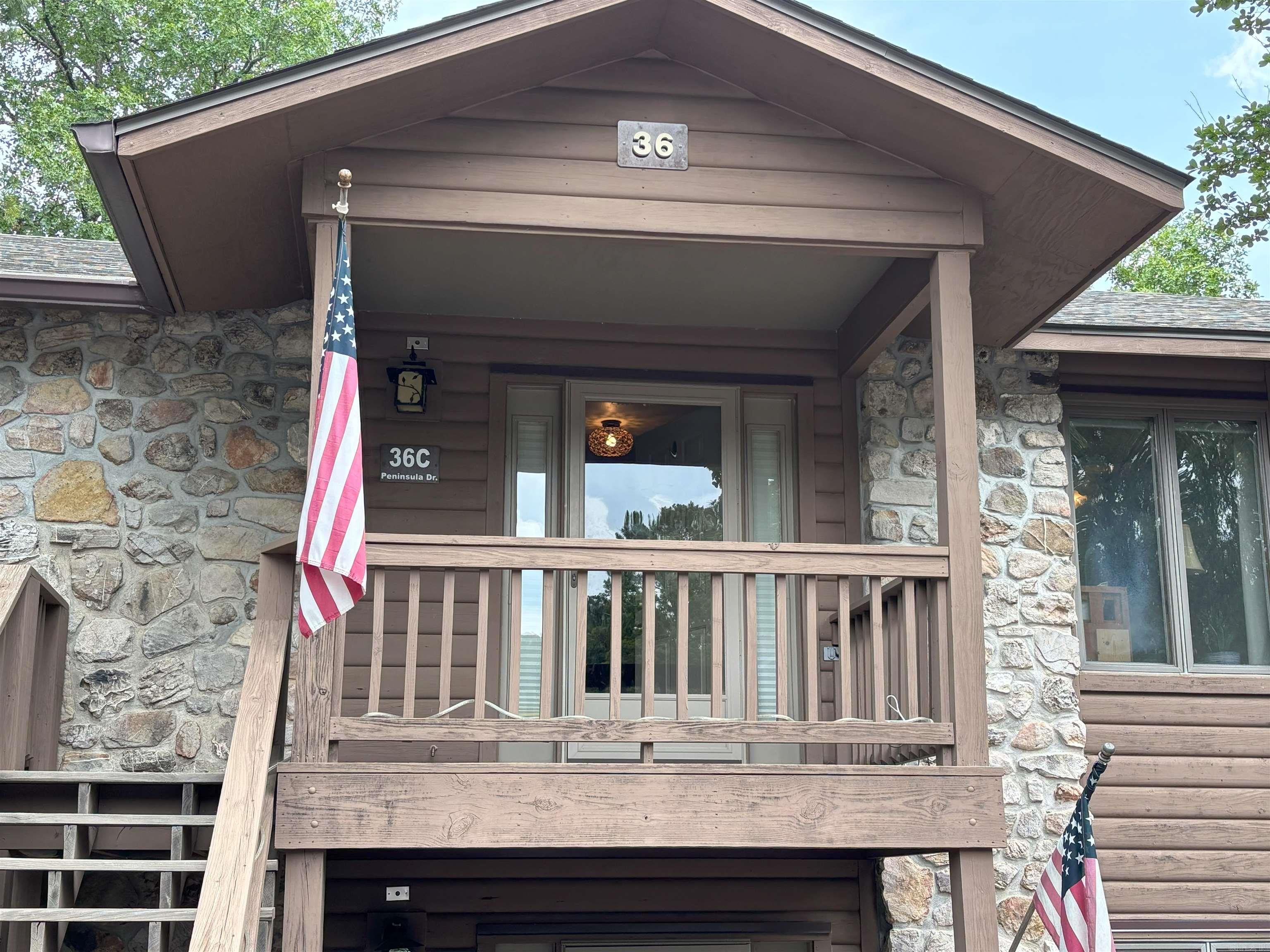 Live that Lake Ouachita Life! This fully furnished upper corner unit is move-in ready for you! Enjoy one of the larger 2 bedroom, 2 bath units that do not come on the market very often. This one is perfect for a vacation property to use and enjoy or as an investment - or both. Enjoy the vaulted ceiling AND lots of trees for privacy on the wrap around deck. Upper unit with only 12 steps to the front door! Call today for your private showing. Agents see remarks.