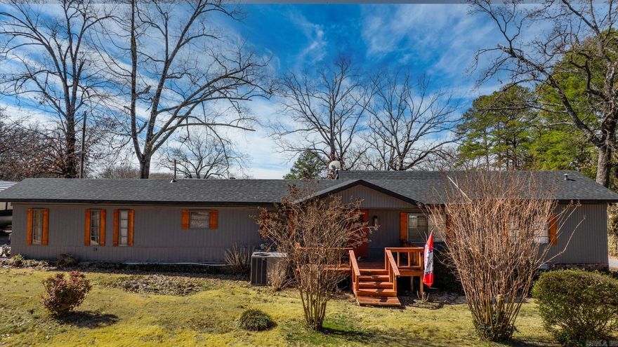 Discover the perfect lake retreat in the heart of Higden! This fully furnished 4-bedroom, 2-bath home offers a spacious split floor plan, a cozy living room, and a large sunroom where you can take in stunning lake views. Recent updates include a new roof, HVAC, exterior paint, and shutters ensuring a move-in-ready experience. Step outside to enjoy the expansive covered patio, perfect for entertaining family and friends. Need storage? The 30x40 shop with electricity and covered boat parking has you covered. Just a short walk to the boat ramp and park, this home is ideal as a vacation getaway, short-term rental, or forever home. Don’t miss this incredible opportunity—schedule your showing today!
