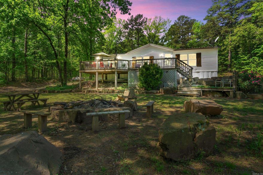 Nestled in the heart of Greers Ferry this home offers the perfect blend of privacy & convenience on a sprawling 2.92-acre lot. Surrounded by nature, this property is a true retreat, featuring a beautiful spring-fed creek meandering around the grounds—a tranquil setting perfect for relaxing or exploring. Inside, the home boasts a warm & inviting layout with spacious bedrooms, a cozy living area, & a well-appointed kitchen ideal for family gatherings. Located just minutes from Shiloh Marina, this property is a dream for outdoor enthusiasts, offering quick access to Greers Ferry Lake for boating, fishing, & water activities. Whether you're looking for a peaceful escape or a place to enjoy lake life, this property delivers it all. Don't miss this rare opportunity to own your private slice of paradise in one of the most perfect locations in Greers Ferry!