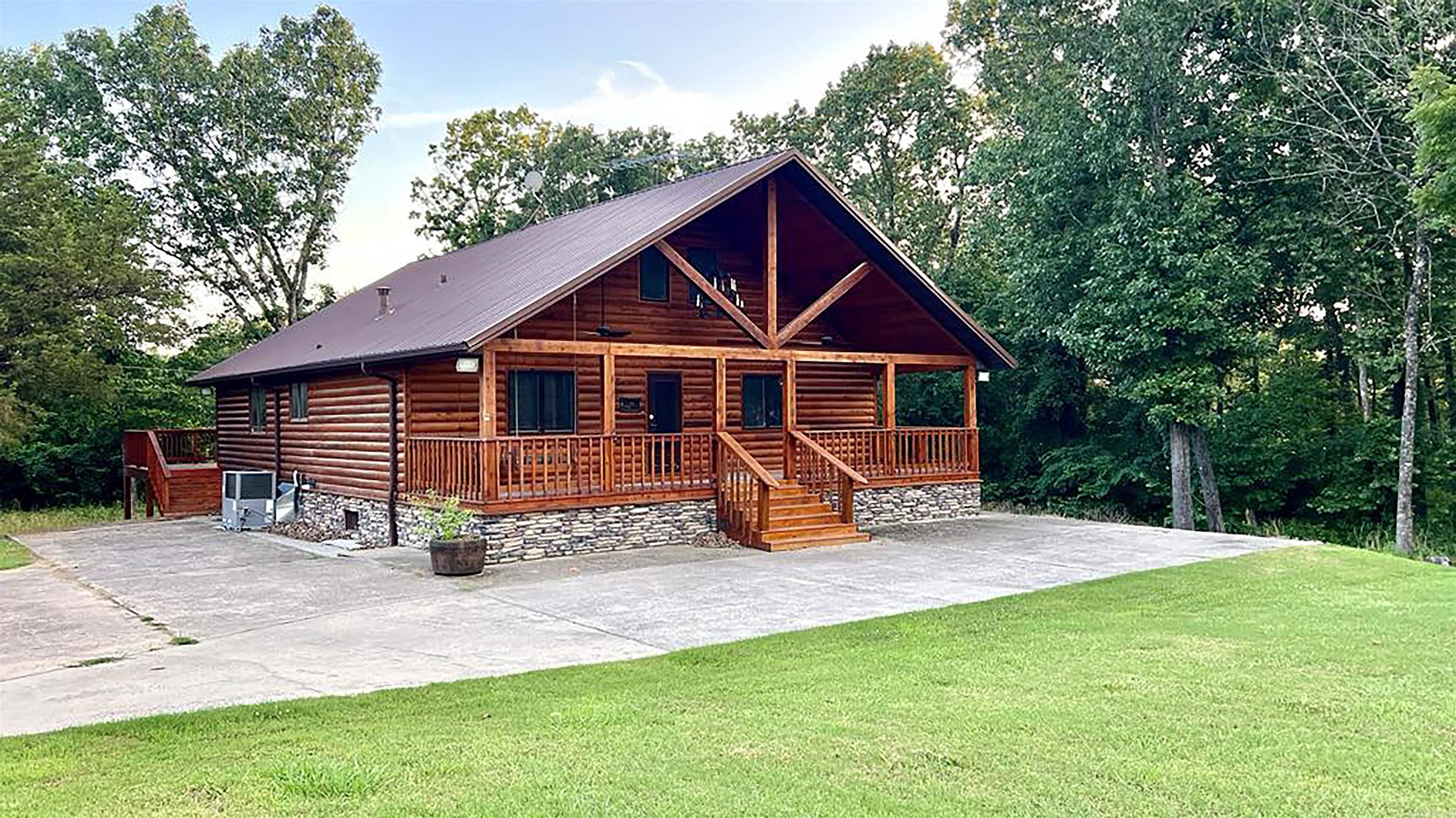 Total Package! Beautiful Rustic Lake Home & boat slip located on Lake Norfork offers a natural look both inside & out! Features 4 Bedrooms, 3 Bath- fully furnished with all new high-quality furniture. The property Joins the Corp with a permitted walking trail in the quiet Diamond Bay Community near Hand Cove. Stunning hand-crafted beams & hardwood floors in the living area. The walkout basement is ready to convert into a den & living space. Upgrades! New front & back decks, basement garage door/auto open, complete water system-hot water tank, water softener, well pump & pressure tank, toilets. Basement resealed, 2 sump pumps and a French drain system, electric vehicle charger, alarm system, ceiling fans outside and inside. New appliances - 2 refrigerators w/ice makers, dishwasher, microwave, washer and dryer. 2 fireplaces (1 wood burning and 1 gas) Boat Slip 10x28 with lift on Diamond Bay conveys with storage locker, a Parti-Kraft pontoon w/50 Hp. 4-Stroke Yamaha motor and trailer.