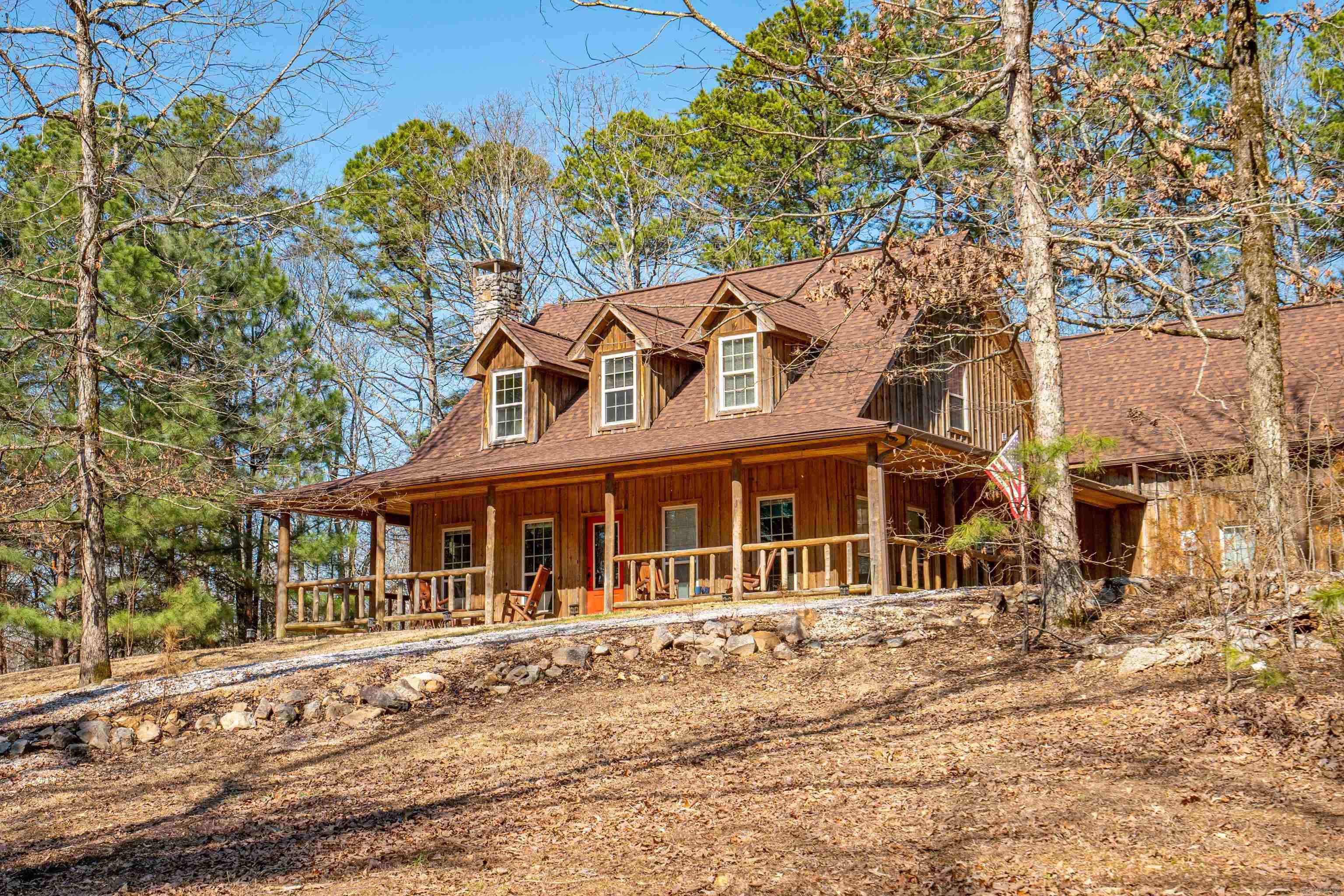 Beautiful Rustic Country style home with large front porch on 4.65 acres in city limits. 3 bedroom 2.5 baths with rock fireplace, stained concrete floors with bonus room over the garage. Home has lots of storage and close to the river.