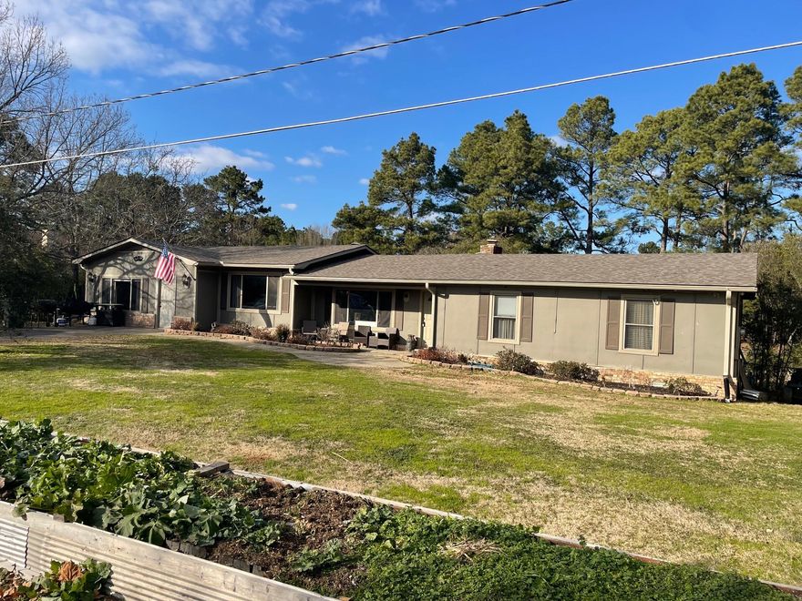 Tucked away at the end of a peaceful cul-de-sac, this well-maintained 4-bedroom, 3-bath ranch-style home offers 2,600 sq ft of thoughtfully designed living space on a landscaped 1.5-acre lot. Inside, you’ll find a spacious layout featuring a cozy gas fireplace in the main living area, a large kitchen with modern appliances (all under 5 years old), and a bright sunroom complete with a custom-built indoor playhouse. The generous primary suite offers its own private entrance, ideal for guests, multi-generational living, or added privacy. Step outside to enjoy a fully fenced backyard designed for both relaxation and functionality. The property includes a children’s playground, raised garden boxes, established fruit trees, and chicken coop—offering an ideal setup for homesteading or simply enjoying outdoor living. A  fully equipped  16x16 ft workshop, accompanied by a separate storage building for additional space and organization. Recent updates include a new roof & HVAC system (5 years old). With no through traffic, ample outdoor space, located 5 minutes from Lake Hamilton school, this one-of-a-kind property is ready to welcome you home.