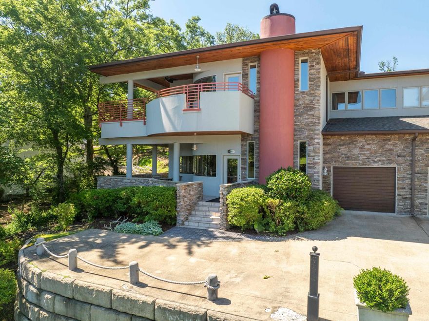 Do you like owning something that is hard to find & rarely available? Would you like a permanent or vacation oasis where you don't ever have to work outside in the yard? Would you like to walk just a few steps to your covered boat slip so you can be right out on the lake in your boat enjoying the sun, wind, & water? This Unique, Gated, Small & Private Development with just 8 Units (each with garage) is exactly what you've been looking for! The architectural features both inside & out will be impressive to even the most discerning eye and makes every day on the lake vibrant whether you're inside or out on your serene covered patio areas. This unit, in particular, enjoys an unobstructed long & wide-angle view of the lake! Once Inside you will enjoy the contemporary feel of a wide open floorpan with lots of glass, natural light, large kitchen, separate work space, half bath, split bedroom floor plan and 10' Ceilings throughout! Your oversized master suite is a relaxing place to clean up & rest after you've been on the lake all day. And, there's even a fun curved sitting area at the end of the long main hallway where you can let your creativity run wild. Call NOW!!!