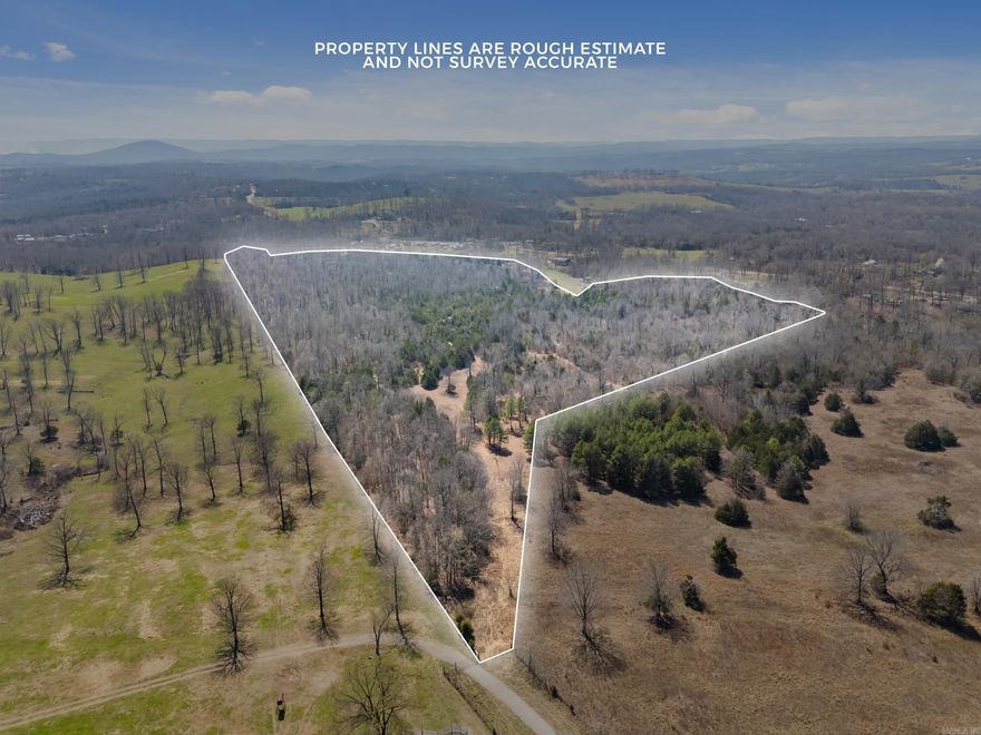 38.38 ACRES of unrestricted opportunity located just minutes from Norfork Lake, Tracy Ferry Marina, and conveniently close to Mountain Home amenities! Discover a rare blend of natural beauty and usability with this fully fenced property featuring rolling terrain, multiple prime building sites, and scenic view potential. A peaceful creek borders the land, creating a tranquil setting for your dream home or a recreational escape. Trails are cut throughout for easy exploration. Enjoy mature hardwoods, abundant wildlife, and even fossil digging opportunities right on your own property. With a Forestry Management Plan already in place, this land offers both immediate enjoyment and long-term value. Privacy, beauty, and location—all in one exceptional tract.