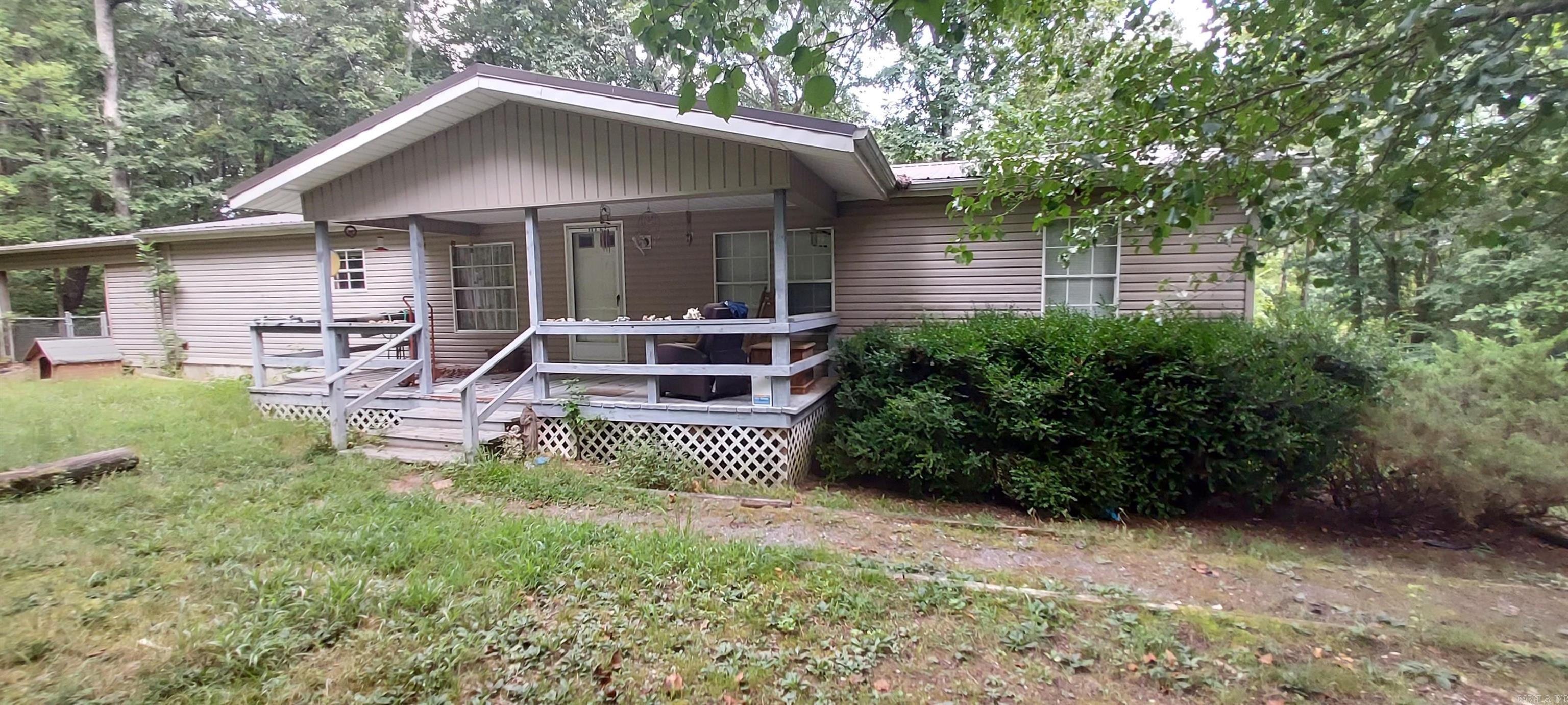 Country Living with Endless Possibilities! Looking for space, privacy, and potential? This 3 bedroom, 2 bath double wide sits on 8.59 peaceful acres in the heart of the country and offers more than just room to roam! Featuring new flooring throughout, a mudroom addition, and front and and back porch for enjoying the serene surroundings. The property includes a covered carport, 8 outbuildingsā6 with powerāproviding ample space for storage, hobbies, or a workshop. One outbuilding even has the potential to be transformed into a cozy guest house with a loft! Enjoy your very own stocked pond, ideal for quiet afternoons of fishing or relaxing by the water. With some land clearing, clean up and TLC, itās the perfect opportunity to own a piece of the country with so much room to make it your own. Bring your vision and make this rural retreat your reality!