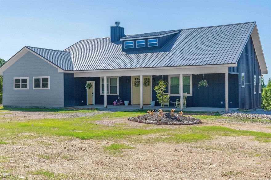 Breathtaking mountain views stretching to the Hwy 70 Bypass! Stunning 2-story, 4-bed/3-bath home, situated on 3 acres MOL with 2-car garage & complete mother-in-law quarters, is a rare find, BARELY LIVED IN! The thrill of NEW without the hassle of building yourself! Perfectly positioned in Fountain Lake School District neighboring Brookhill Ranch & Hot Springs Village just 15 minutes from Hot Springs! Luxurious finishes throughout including gorgeous quartz countertops & a spacious 9x6 wet room with soaker tub! The Chef's Kitchen, a culinary dream, features an island, gas range, pot filler, double ovens, & a walk-in pantry. The expansive living area, with 14-foot ceilings, showcases a beautiful contemporary fireplace & opens to a large patio area, so you can bask in the serene mountain views. The airy primary ensuite with sitting area overlooking the mountain tops and his & her walk-in closets is conveniently located on the main level, along with a guest suite & mud/laundry room. The lower level is perfect for guests or extended family featuring 2 roomy bedrooms, full bath, full kitchen & spacious living plus a 14x42 climate-controlled storage room & encapsulated crawlspace!