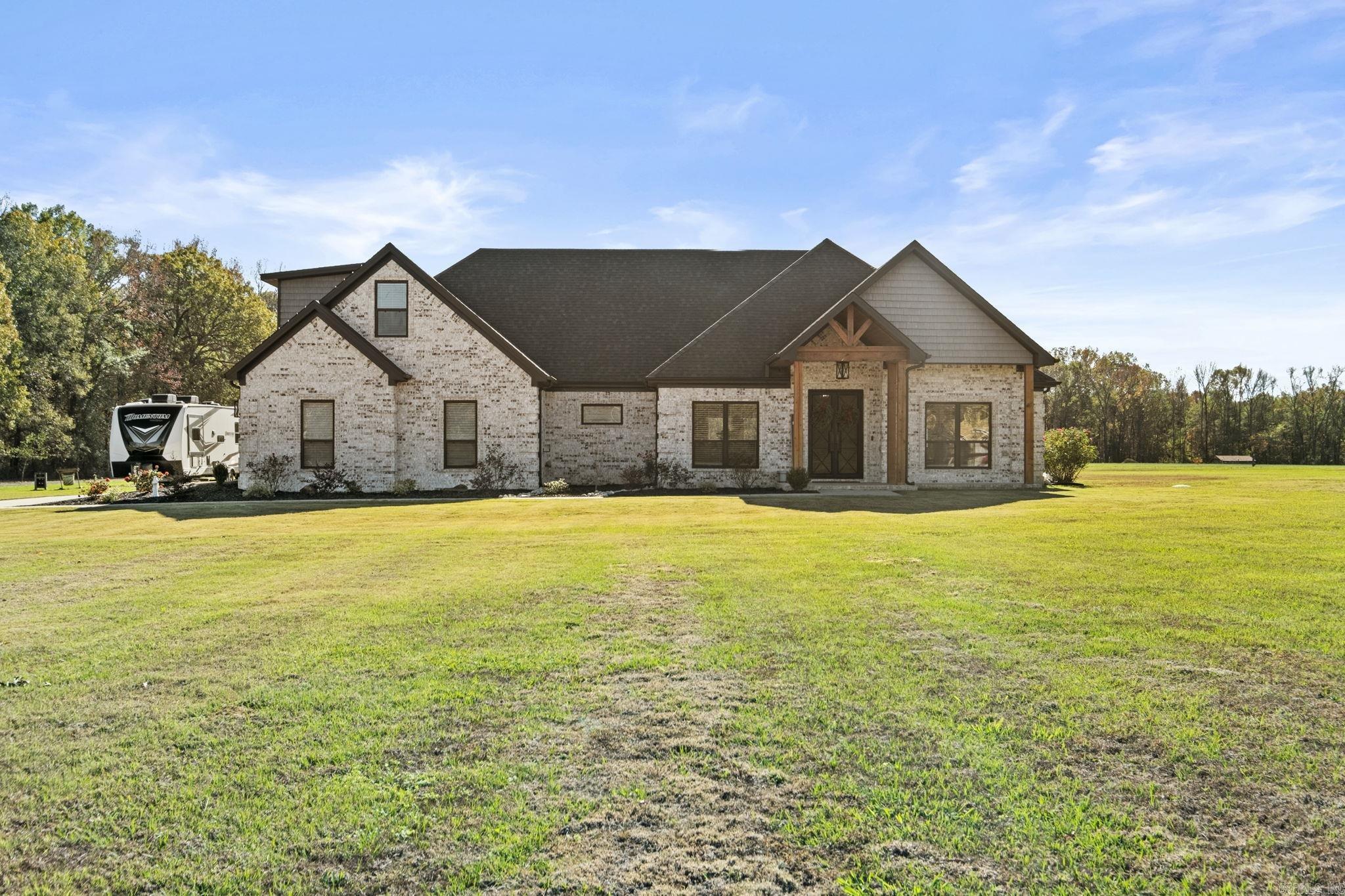 This Breathtaking 4 Bedroom, 2 1/2 Bath property is perfectly situated on close to 3 Acres, offering Space, Style, & Serenity! With Custom Details throughout, this home combines charm with modern comforts, creating an ideal haven for your Family! An Open Floor Plan makes up the Great Room with oversized Electric Fireplace, a Formal Dining Room, & Amazing Kitchen with Large Island & Under & Over Cabinet Lighting! The Master Features Custom Touches with it's own Electric Fireplace, Private Bath with Soaking Tub, Walk-in Shower, & Amazing Closet adjoining the Laundry Room! All Spare Bedrooms are Great Size! Upstairs is an Oversized & Well Layed out Bonus Room which could also serve as another Bedroom or Teen Quarters! The Outdoor Living Space Features a Covered Patio complete with patio swings, and an AMAZING Inground Salt Water Swimming Pool that was just Built in 2023 & Relaxing Hot Tub! Other Features include a 3 Car Garage, Energy Efficient HVAC and Gas Furnace, and a Prep Site for a Future Shop! Every corner of this home exudes Quality & Care. Don't miss the Opportunity to make it yours!