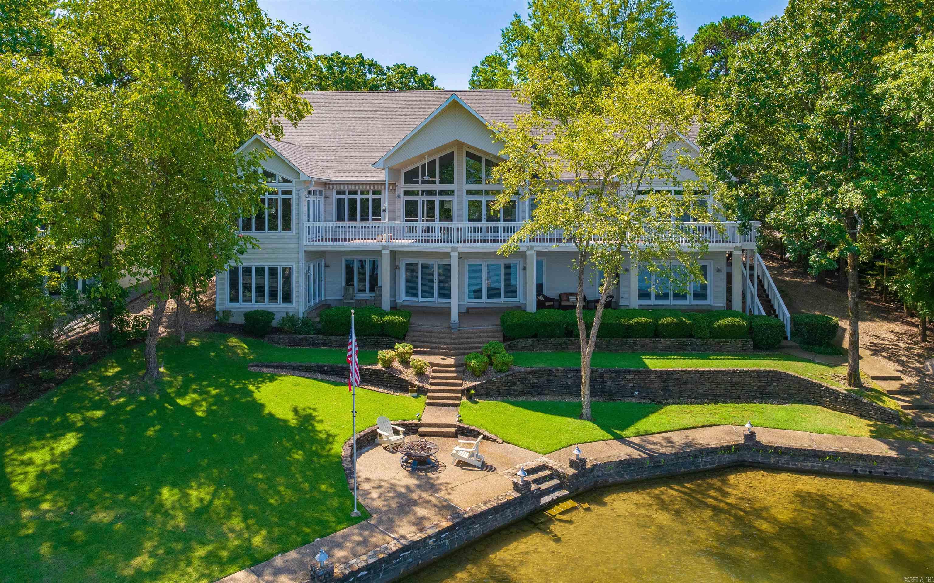 SPECTACULAR LAKE BALBOA HOME! Built in 1998 and completely updated this fabulous lake home is located on a premium .52 acre lot. Features BIG Lake Views, Grand Circle Drive Entrance, 3-Car Extended Garage, Cedar Closet, Open Floor plan with beamed & vaulted ceilings, Built-In Cabinets, Media Center with surround sound, Extensive Landscaping, Covered Reinforced Boat Dock with Hoist/Lift, second Primary Suite and wet bar with ice maker on lower level. Upgrades include GORGEOUS primary bath with Bubble Tub, and three lovely guest baths, Viking professional kitchen & Sub-Zero Refrigerator, granite counter tops, stainless appliances and backsplash, luxury vinyl tile throughout lower level, new deck planking, new lighting on dock and new ceiling fans on both deck levels, New Roof, and new silhouette window treatments to allow natural light throughout this home. There is an additional refrigerator/freezer in garage and two kayaks to convey. A one of a kind EXQUISITE HOME and ready for you to enjoy every SUNSET..