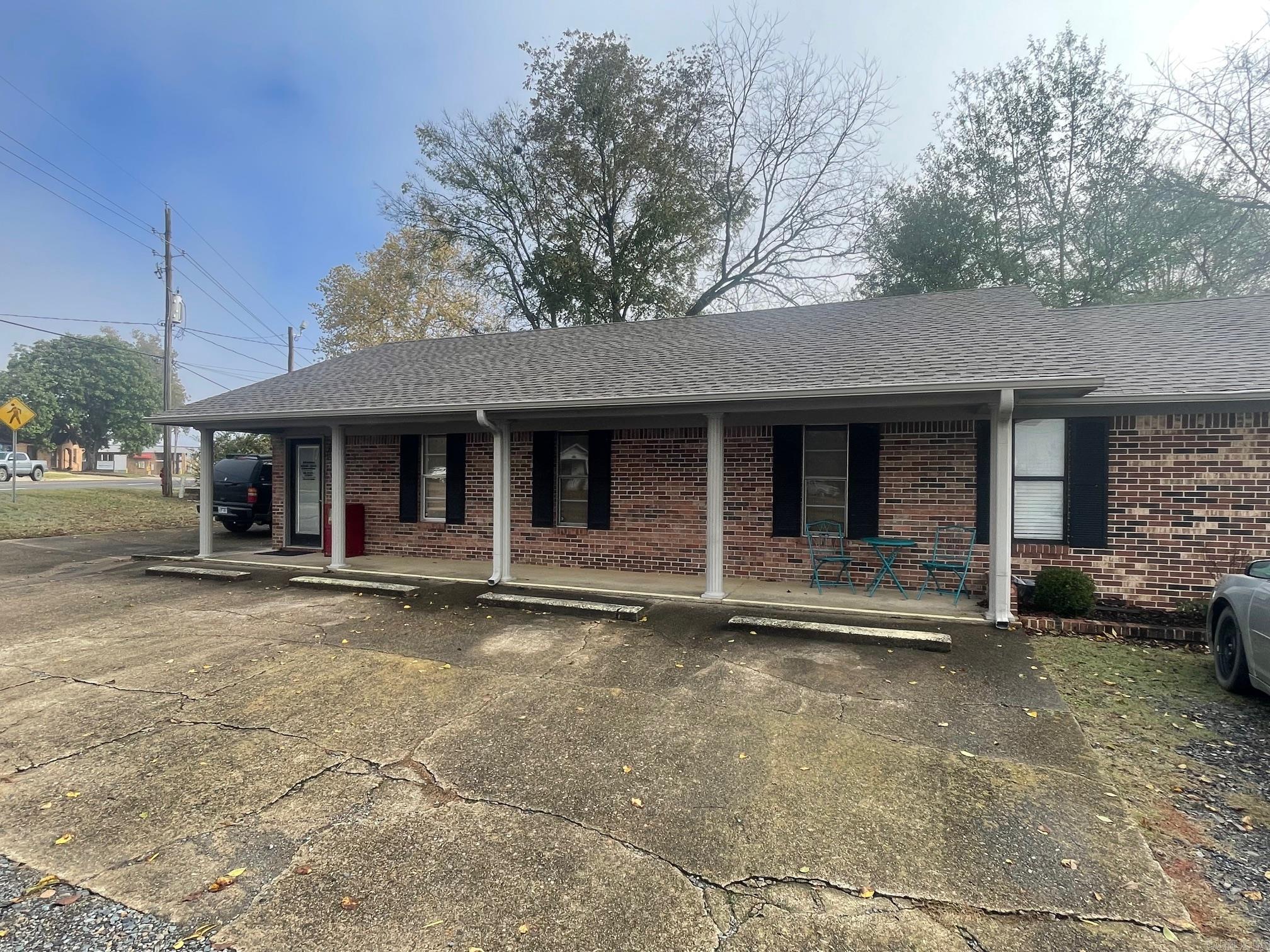 Large Office Building with 8 Offices and 2 bathrooms right on Hwy 71 s. Lots of visibility with this Office Building! New Roof and New Flooring! Lots of Parking Space! Ready for your Business!