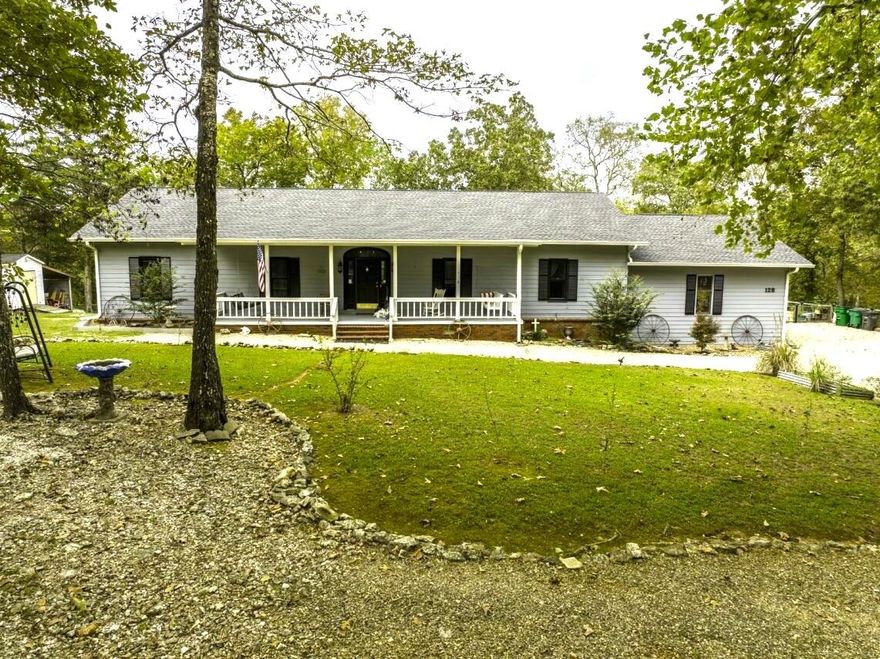 Riverfront Home with Walkout Basement & 2 Living Areas - Cherokee Village, AR     This beautiful property sits on 2 acres along the South Fork of the Spring River. You'll be just minutes from the Spring River, Lake Thunderbird, Lake Sequoyah, Lake Cherokee, Lake Sherwood, and Lake Omaha.  This spacious home offers over 4,000 square feet under roof, including 4 bedrooms, 3 bathrooms a fully finished walkout basement and 2 full kitchens, making it ideal for multi-generational living or guest quarters. The main level offers 3 bedrooms & 2 baths with a fully equipped kitchen that opens to a large living room with fireplace that extends to an enclosed sun porch. Step out onto the open front porch that overlooks 300+ ft of river frontage. Add'l features include a master bedroom that extends out to the sunporch, a huge master bathroom with jacuzzi tub, a formal dining room, an oversized double garage, & a long covered front porch.  Downstairs, the walkout basement offers a complete 2nd living area with its own newly installed kitchen, pantry, bedroom, large bathroom, laundry room, safe room and huge living room with fireplace. A covered patio extends to the steps leading down to the river