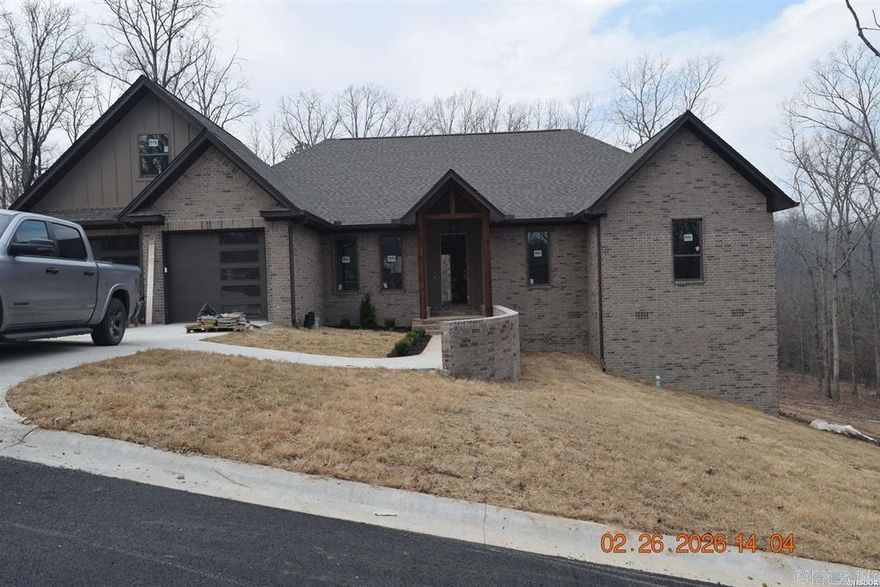 New construction not yet complete, offering a 4 bedroom, 3.5 bath layout with modern features throughout. Energy-efficient appliances, an efficient heat-and-air system, and a tankless caution hot water heater are already in place. Vaulted ceilings and two gas-powered fire inserts create a warm, inviting atmosphere.  A standout feature is the bonus room located behind the home, built with cement walls—ideal for use as a safe room, storm shelter, hobby space, or secure storage. This property gives the next owner the opportunity to finalize remaining details and make the finishing touches their own.