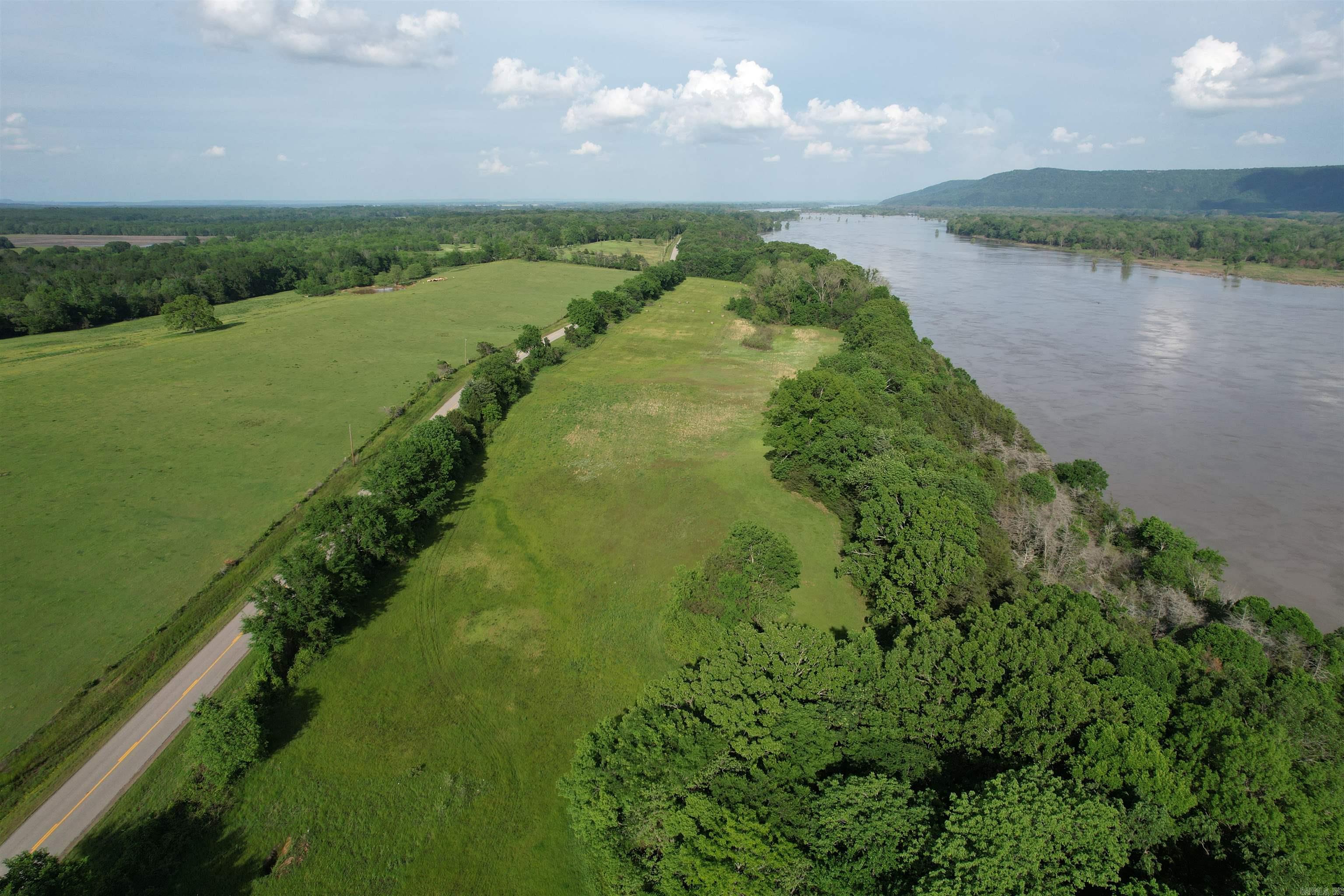 Stunning 3.86-acre property on the Arkansas River with breathtaking views of Petit Jean Mountain! A perfect homesite, this unique parcel features a dramatic 10-ft bluff leading to a scenic rock ledge along the riverbank. Enjoy peaceful riverfront living, stunning sunsets, and unmatched natural beautyāideal for your dream home or weekend retreat. A rare opportunity to own riverfront with a view! Additional adjacent acreage available. You will not find a more perfect, unique spot to build! Adjacent lots are also for sale for your opportunity to own even more acreage in this magical location! Also, this property is minutes from a AGFC wildlife preserve and boat ramp into the Arkansas River. You just can't beat it!