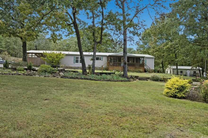 Nice well kept four bedroom - two bath home with office Has a good metal roof & good heat and air system, both less than 5 years old Has a nice 30x40 metal building - gravel floor Has another building 18x32 with central heat and air Green house, lots of landscaping, playground area for kids Fully Fenced, sits back off the road, has a private feel