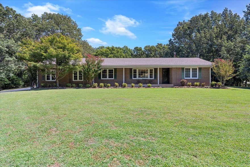 This unique ranch-style home on 15 acres offers the perfect balance of peaceful country living with the convenience of being just minutes from town. Step inside and discover multiple living spaces designed for both relaxation and entertaining. The open-concept layout features a recently remodeled kitchen with a stunning Cambria quartz island and countertops, abundant storage, and large pantry. The oversized den is a true gathering spot, complete with built-ins for storage and plenty of room for entertaining. A recently added owner's suite provides a luxurious retreat with a spa-inspired bath, large walk-in closets, and a sitting room/office. Three additional bedrooms ensure comfort for family or guests. Additional highlights include:  Beautiful porcelain tile flooring throughout, with original parquet floors in guest bedrooms, finished basement with recreation room and large safe room,  expansive barn/workshop with horse Stable and additional storage building. With 15 acres of possibilities, this property is ideal for anyone seeking space, versatility, and a true country setting without giving up convenience.