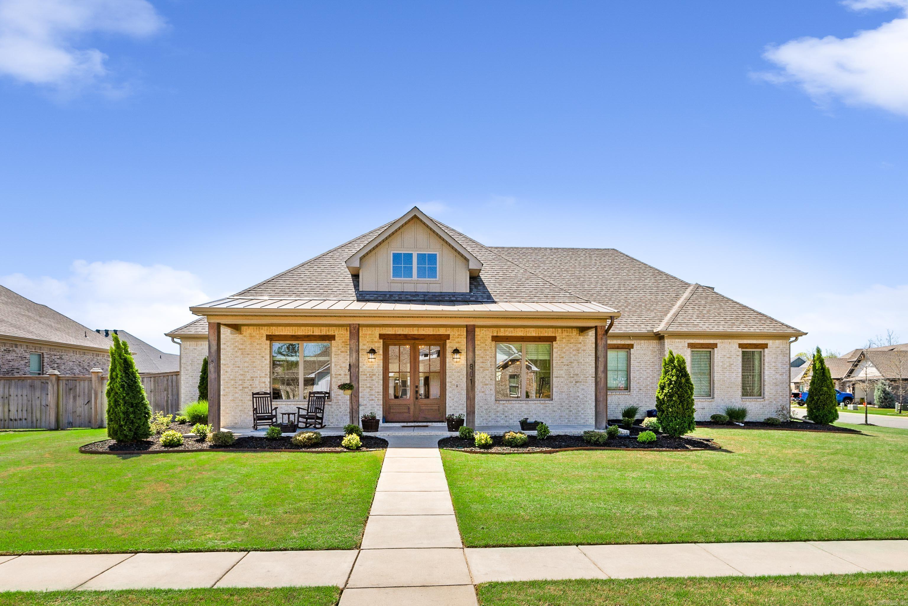 Stunning home on a large corner lot in The Preserve at The Woodlands! This immaculate home is in a community with walking trails, a playground, and a sparkling pool. It features 3 bedrooms, an office, and 2.5 baths on the main level, with a 4th bedroom, spacious bonus room, and full bath upstairs. The open-concept living area has a vaulted ceiling and flows into a beautifully designed kitchen with custom cabinets, a 36” gas range with double ovens, and a large walk-in pantry. The primary suite offers a spa-like retreat with a double vanity, custom-tiled shower, and a large walk-in closet. The foyer opens to a gorgeous office with 12 ft ceilings and a barn door, plus a spacious dining area. The downstairs bedrooms share a Jack and Jill bath, each with its own vanity and walk-in closet. High-end finishes include 10-foot ceilings, 8-foot doors, and detailed trim work. Enjoy the covered back porch with a cozy fireplace—ideal for year-round entertaining. The fully fenced backyard has extra landscaping for privacy and beauty. A sprinkler system and 3-car side-load garage complete this exceptional home.