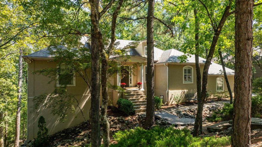 Remarkable custom-built home tucked away in the secluded hills of Pleasant Heights. You’ll love this light-filled retreat with its flexible floor plan, ideal for  entertaining or quiet evenings at home. Gather around the cozy fireplace while overlooking the private, 1/2 acre+ lot. Feels like living in an enchanted treehouse, but with every modern comfort. The primary suite is a true retreat, featuring its own fireplace & floor-to-ceiling windows. Large walk-in closet, spa-like jetted tub, walk-in shower, built-ins, & double-sink vanity complete this luxurious space. New Andersen floor-to-ceiling windows span the entire length of the back of the home, flooding the interior with natural light and framing the lush outdoor scenery. The updated kitchen boasts granite countertops, a breakfast bar, generous storage, and plenty of space for a dining table. Lower level offers a spacious second den with a wet bar, 2nd half bath, & gorgeous custom bookshelves. Two additional bedrooms with Jack&Jill bath, laundry room and abundant storage. Every room opens to a beautiful deck, extending your living space outdoors. A home like this is rarely available, this could be the one you're looking for!