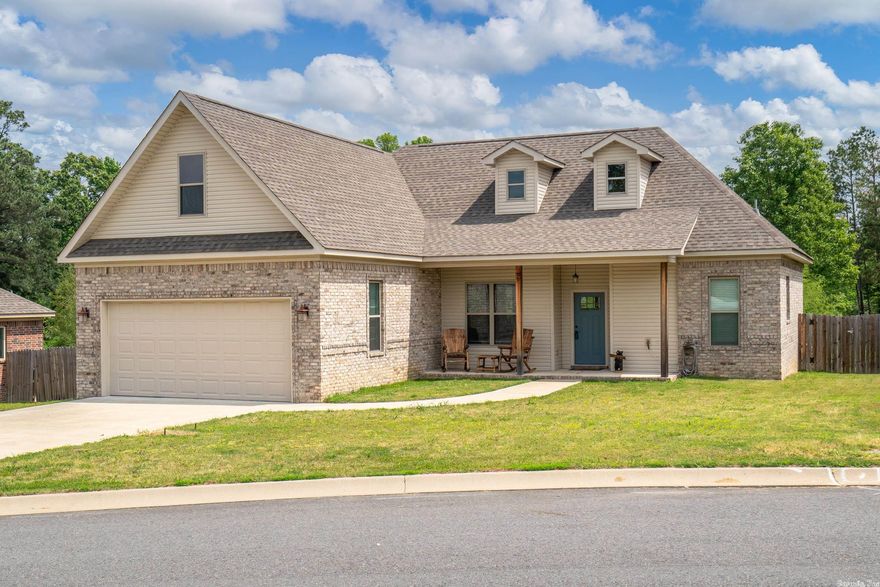 This One is Perfect! Come see this nearly new & lovingly cared-for 3 bedroom 2 bath! You'll love the open floor plan, vaulted ceiling & gas log fireplace in the living area, dining area open to the kitchen which features granite countertops, stainless appliances & large walk-in pantry! Built in bench seating for kitchen table! The master suite has a big walk-in closet & en-suite master bathroom with double sinks! Grey paint colors through out...pretty granite!!! GREAT lot! Back yard has covered seating & looks out over a pond! Walk up attic with tons of storage! Call for showing...501-766-9093!